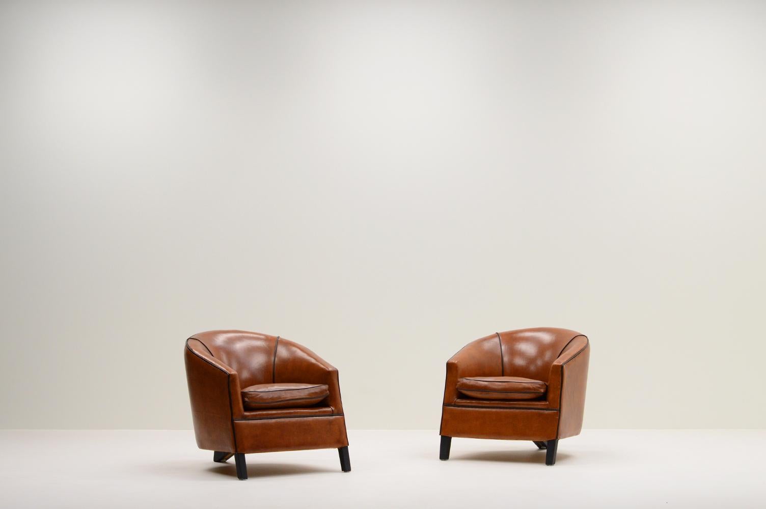“Charel” chair by Bart van Bekhoven, 1980s The Netherlands. Bart is know for his unique designs. The chairs are professionally reupholstered with the finest scheep leather from New Zealand and patinated. The chair has 3 legs upholstered with black