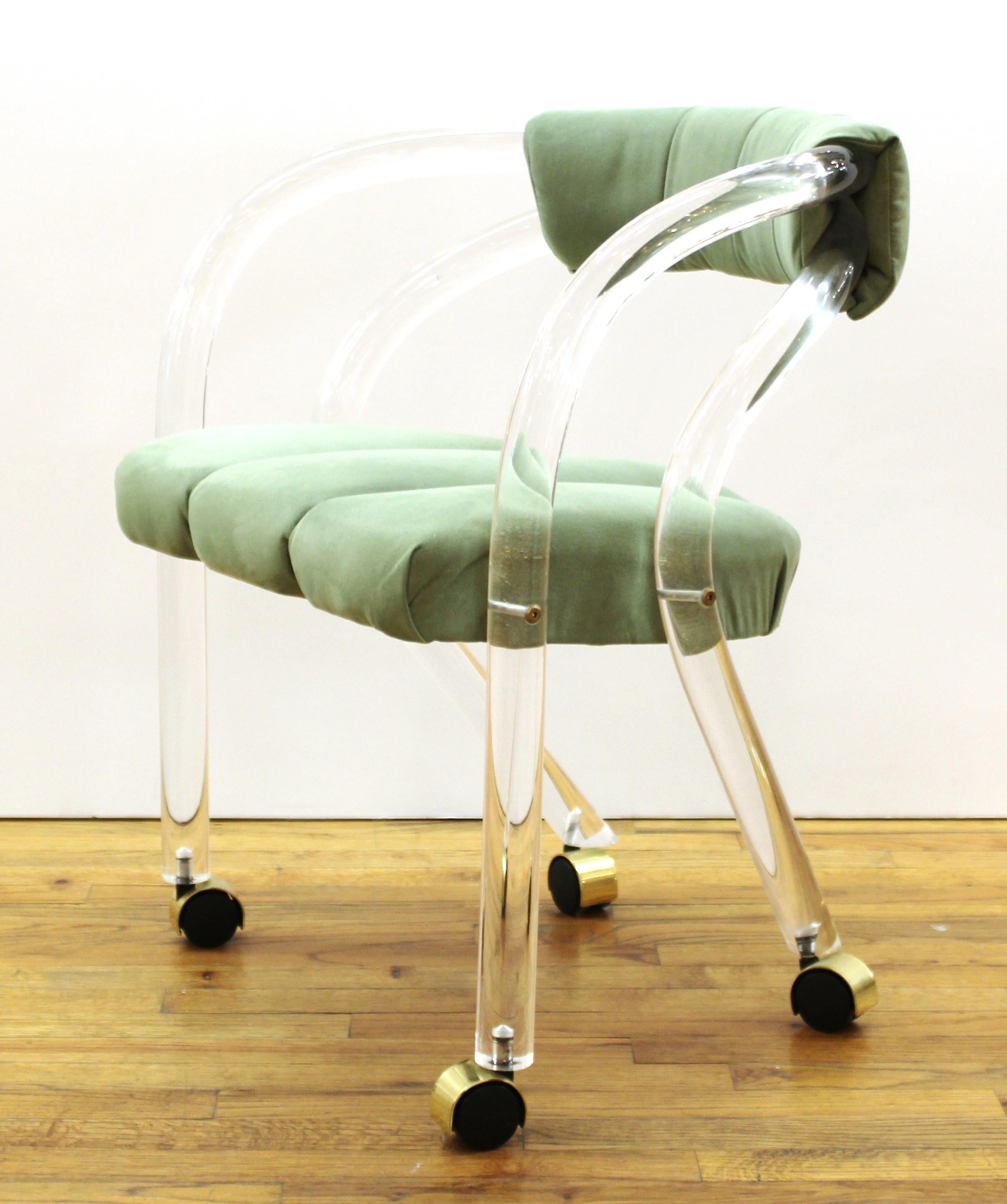 Set of four Modern double-band Lucite armchairs on casters with green upholstery by Charles Hollis Jones. In great vintage condition with age-appropriate wear and use.