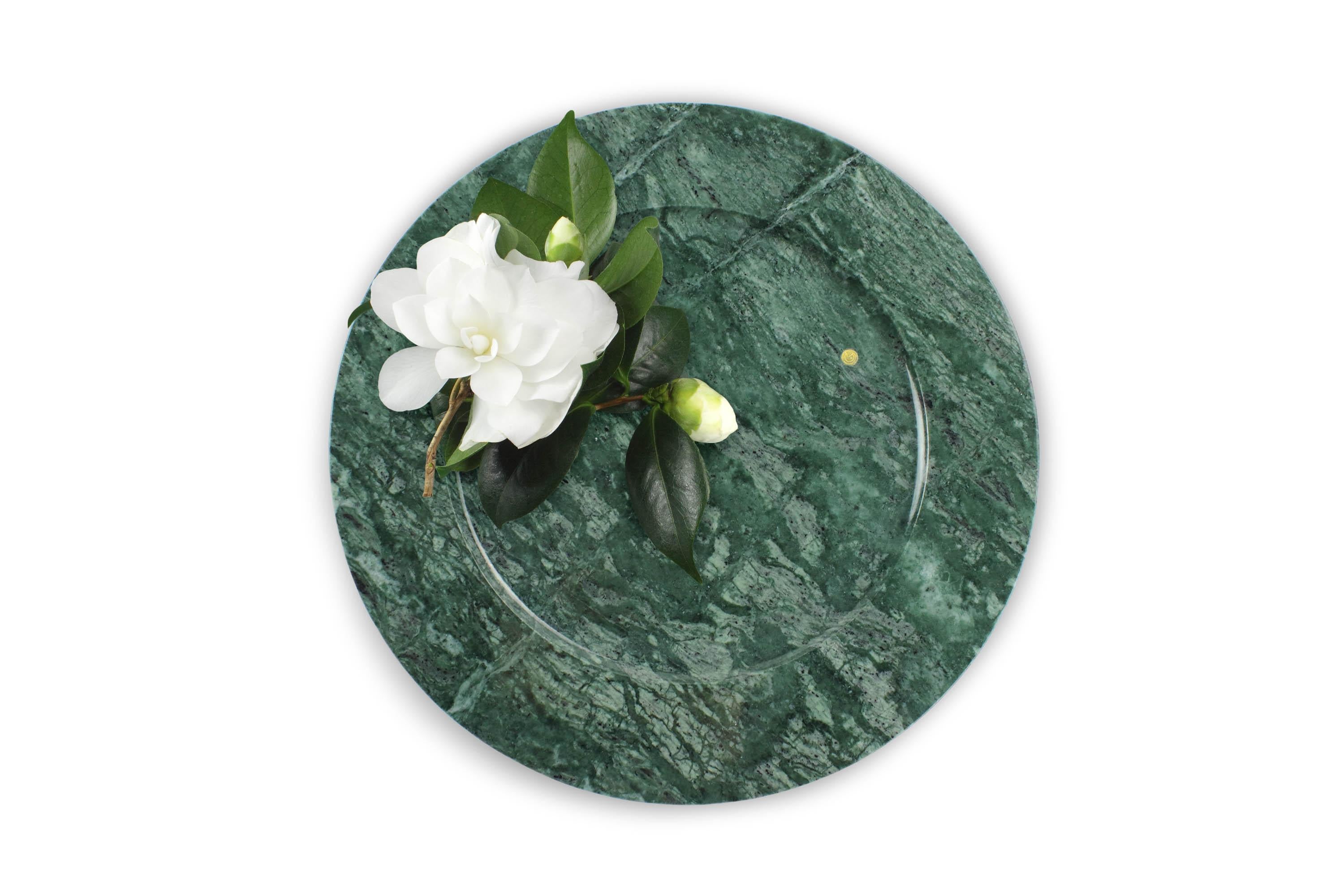 Hand carved charger plate from Imperial Green marble. Multiple use as charger plates, plates, platters and placers. 

Dimensions: D 33 x H 1.9 cm. Available in different marbles, onyx and quartzite. 

100% Hand made in Italy. 

Marble is a natural