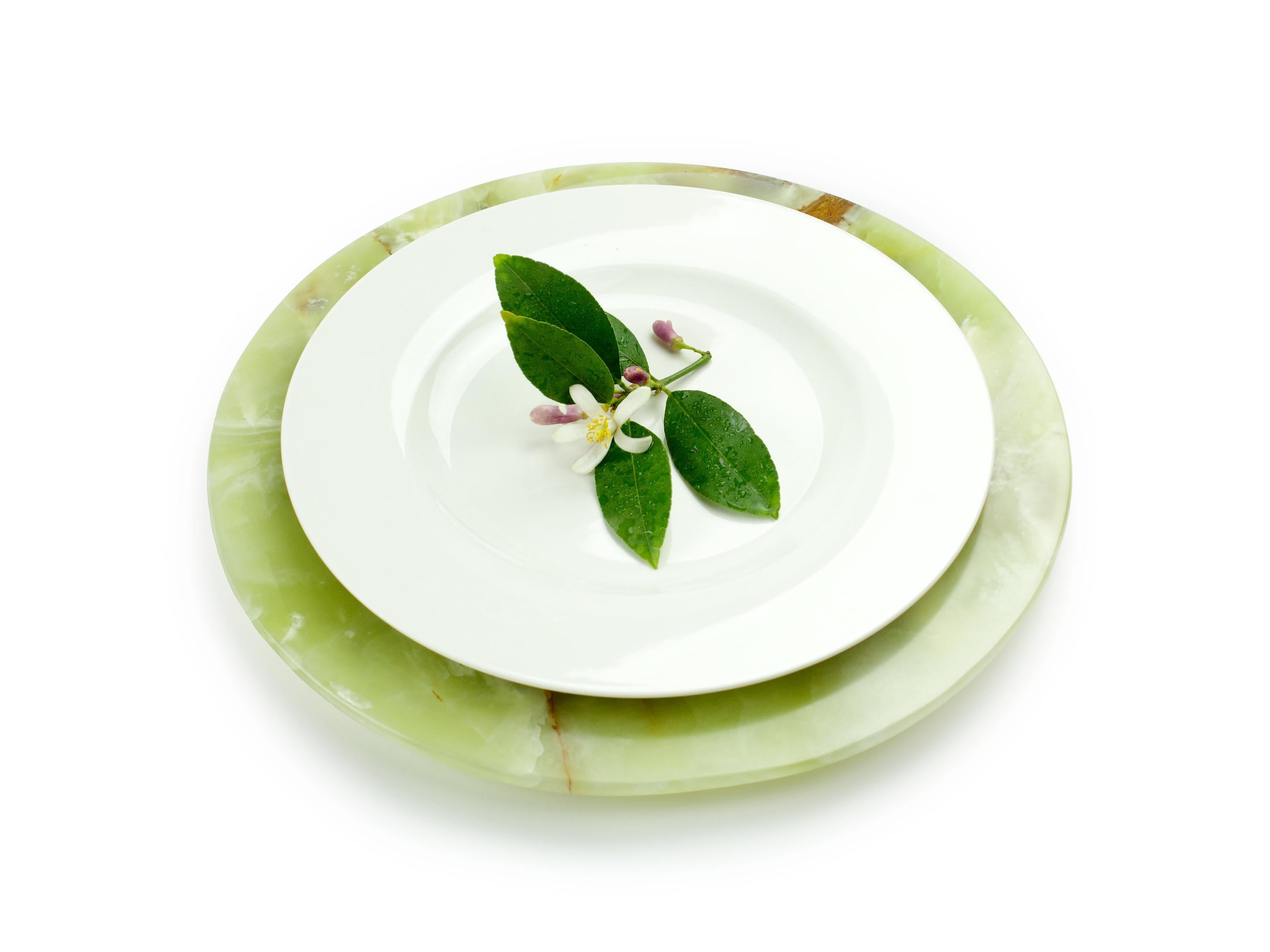 Hand carved charger plate in green onyx. Multiple use as charger plates, plates, platters and placers. The polished finishing underlines the transparency of the onyx making this a very precious object.

Dimensions: D 33, H 1.9 cm. Available in