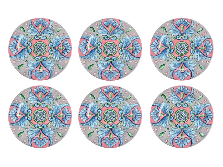 This colorful set of 6 majolica charger plates is handmade and hand-painted in Italy following the original Renaissance painting technique, unchanged over time, which we observe to the letter.
The elegant decoration is composed by a halo of blue