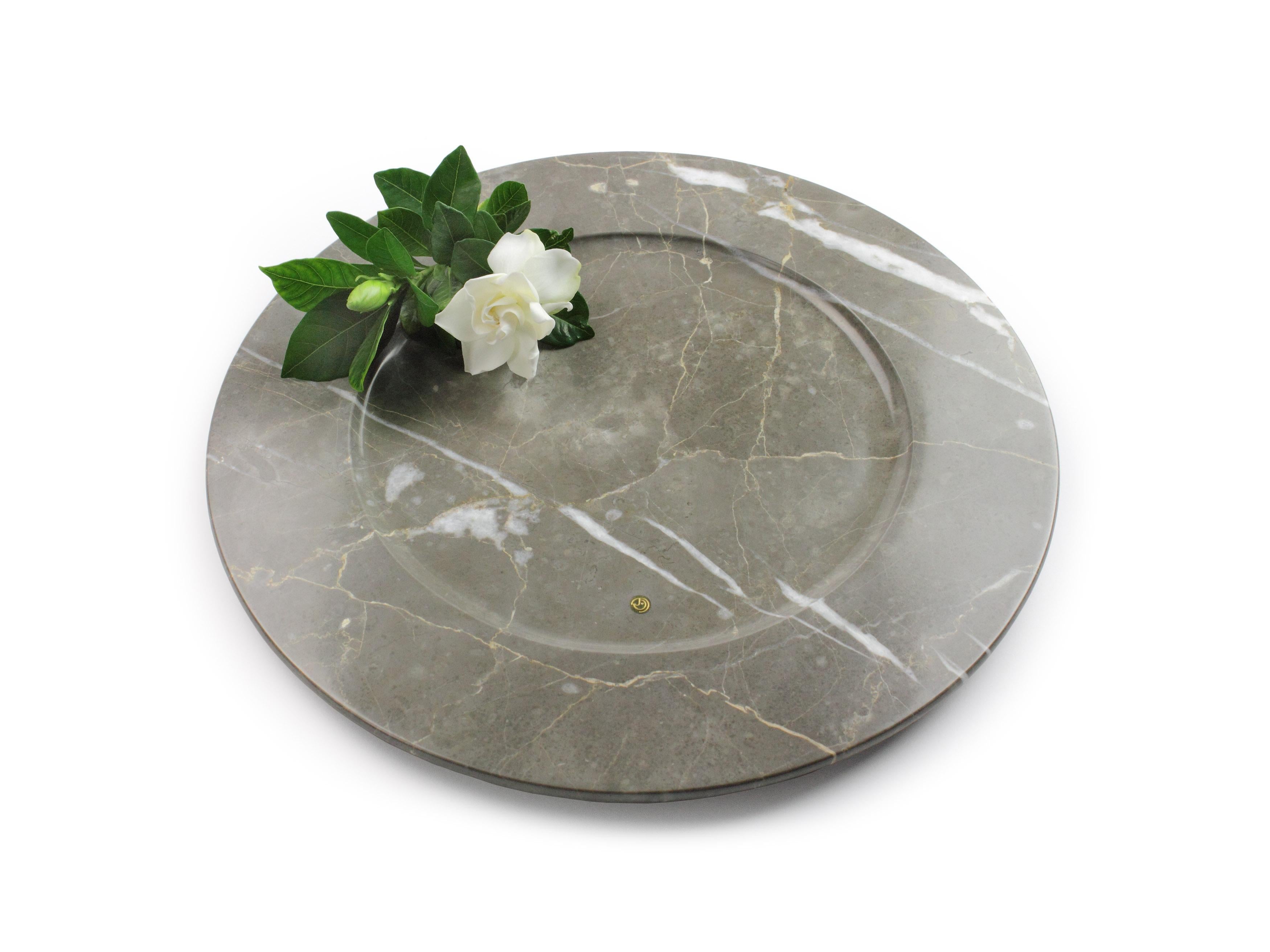 Set of 4 hand carved charger plates from imperial grey marble. 
Multiple use as charger plates, plates, platters and placers.

Dimensions: D 33 x H 1.9 cm. Available in different marbles, onyx and quartzite. 

100% Hand made in Italy. 

Marble is a