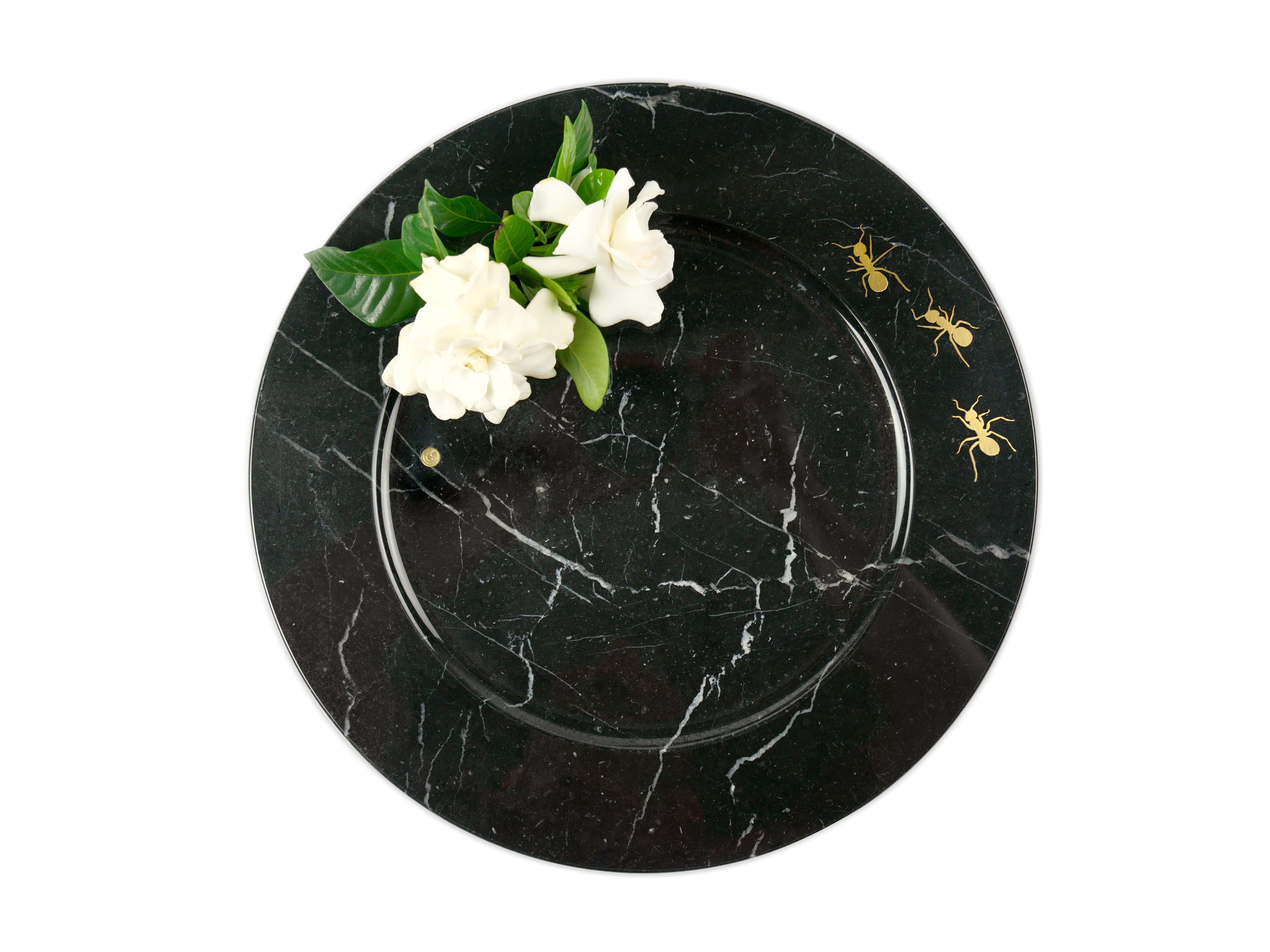 
Set of 6 hand carved charger plate from black Marquinia marble with 3 brass ants inlay. Multiple use as charger plates, plates, platters and placers.

Dimensions: D 33 X H 1.9 cm. Available in different marbles, onyx and quartzite.

100% Hand made