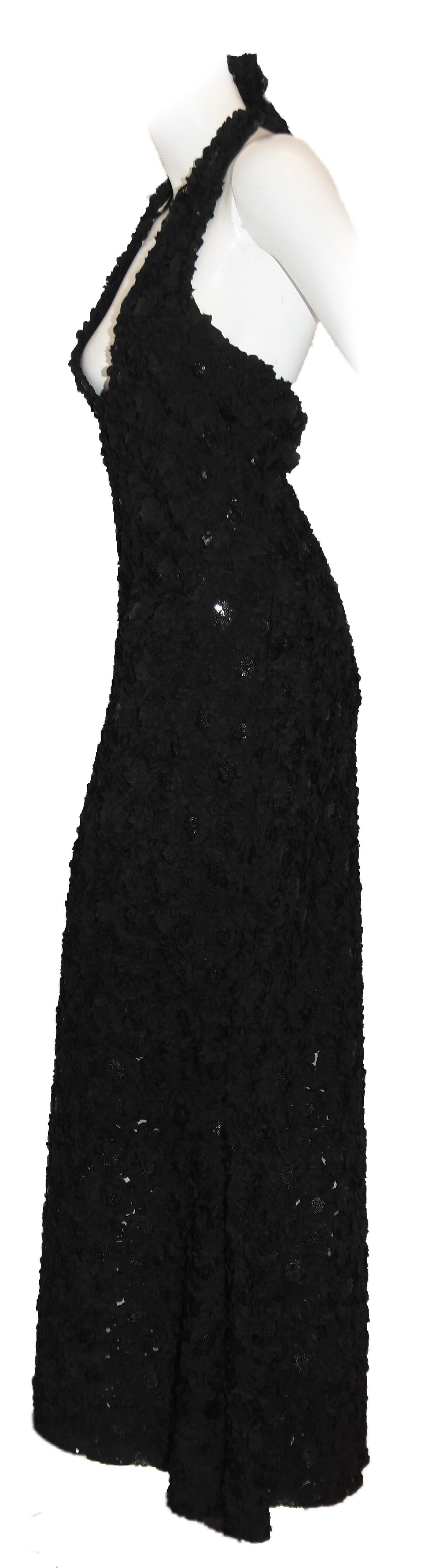 Carrie-Me Couture black halter dress contains two long sashes to be tied at the back in a bow or just a knot.  This dress includes mini fabric rosettes with sequined center throughout the entire dress. This dress is not lined.  As with the mermaid