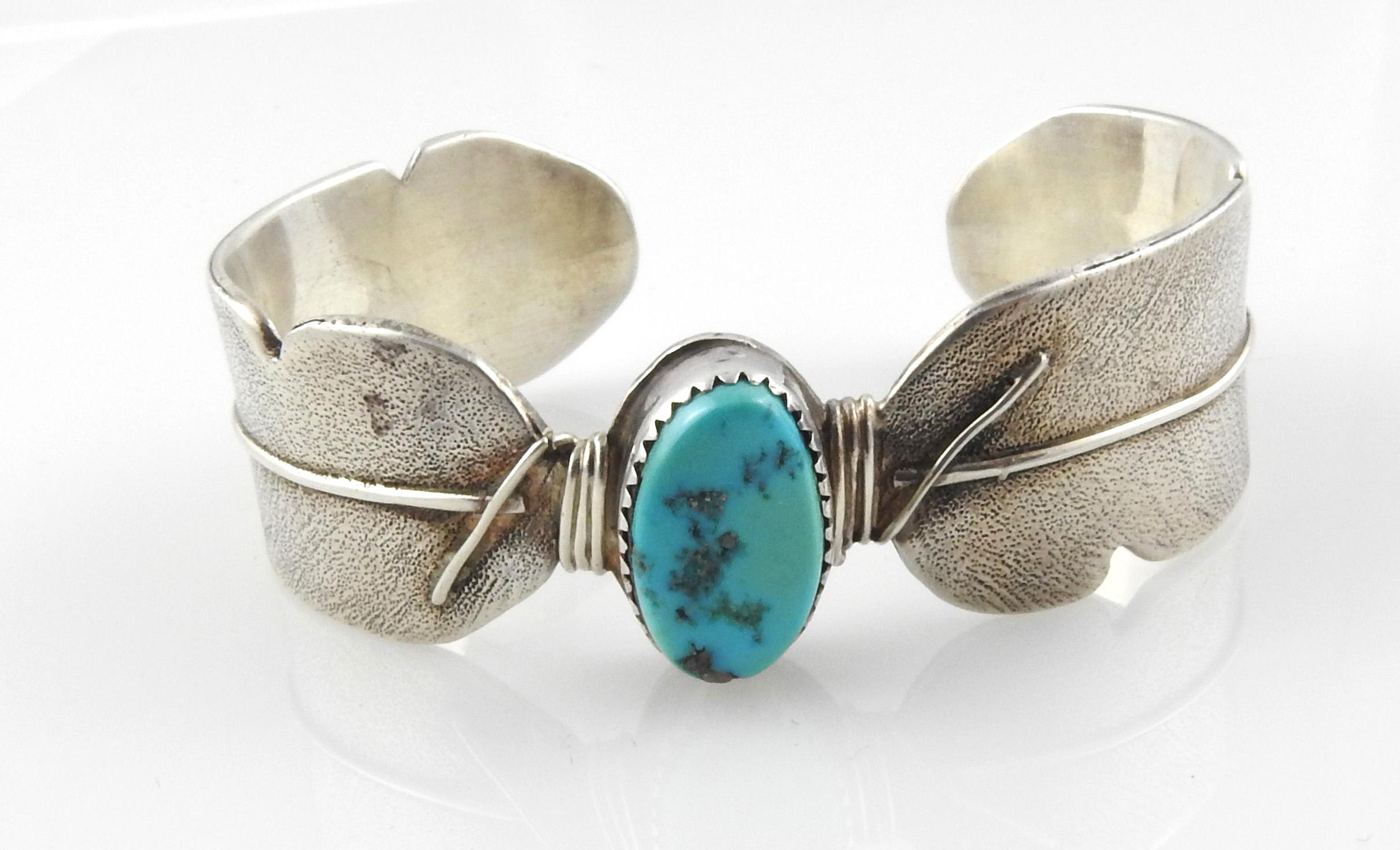 Charlene Dishta, Zuni Native American sterling silver cuff bracelet with turquoise.

Marked: DISHTA, STERLING

Measures: 5 1/2