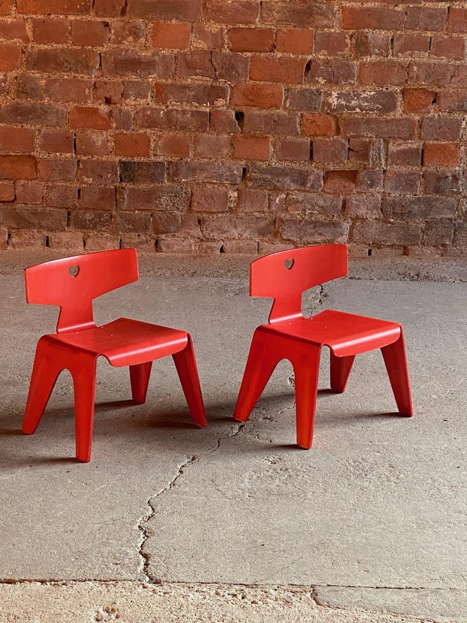 Charles and Ray Eames children's chairs, 2004

Super rare Charles and Ray Eames children’s chairs originally designed in 1945, perfectly moulded birch wood construction, the backrests pierced with heart motifs, in red dyed finish with applied