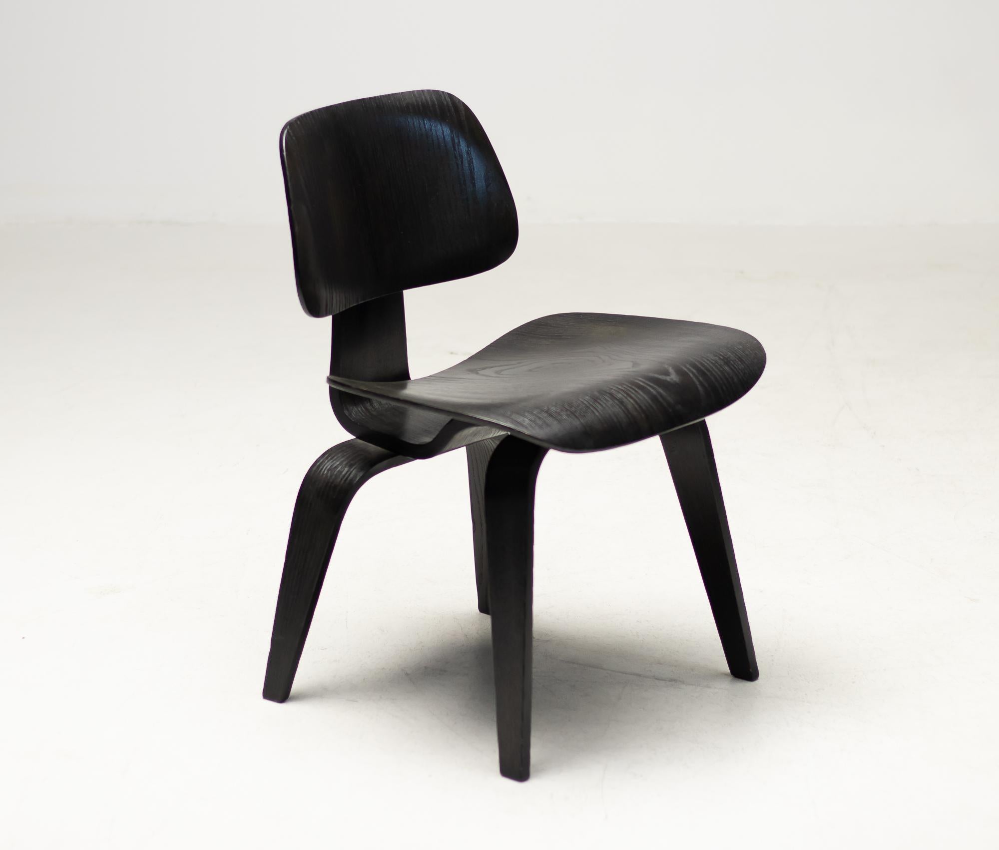 Iconic 1960s Herman Miller DCW dining chair in black dye ash plywood. Great all original condition.
Stamped DCW at the bottom.
