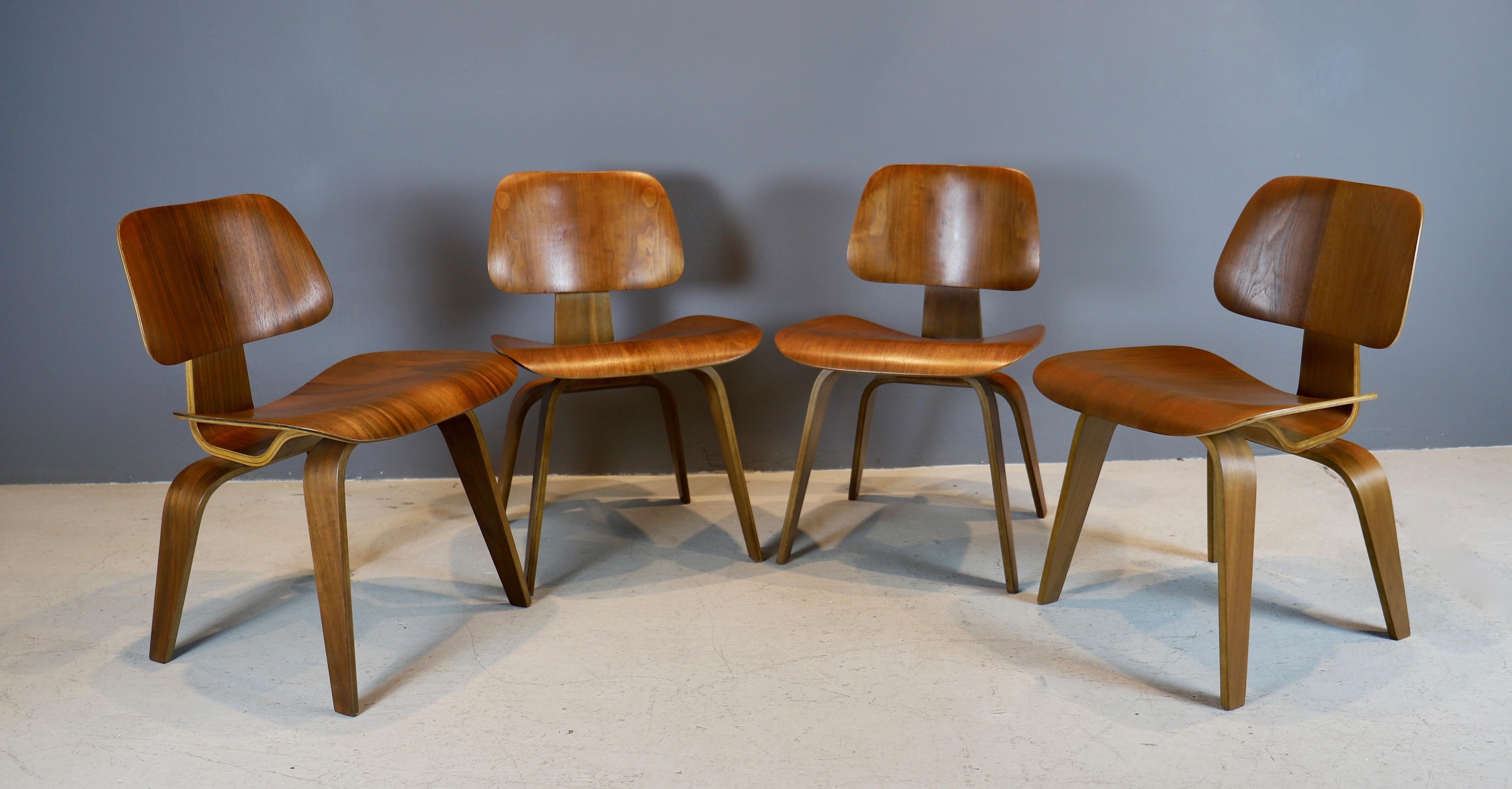 Iconic set of four “DCW” chairs by Charles and Ray Eames in walnut
plywood, circa 1940s - first generation.
Early Evans production, 5/2/5 screw configuration underneath.
Chairs have been cleaned and polished, ready for use.
Old screw repair on