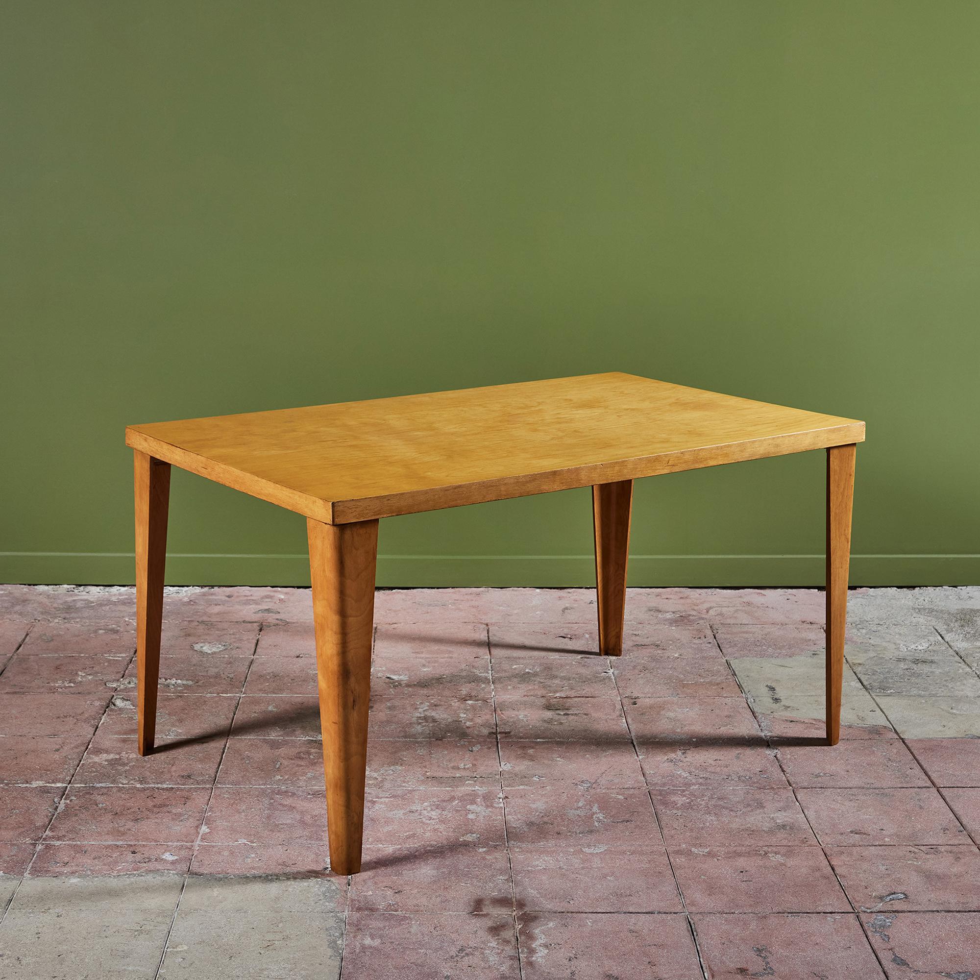 Rare early rectangular dining table in maple bent plywood designed by Ray and Charles Eames and produced by Evans Plywood Division for Herman Miller. Dubbed the DTW-1 (“Dining Table Wood”), this example was introduced in 1945. The DTW-1 has four