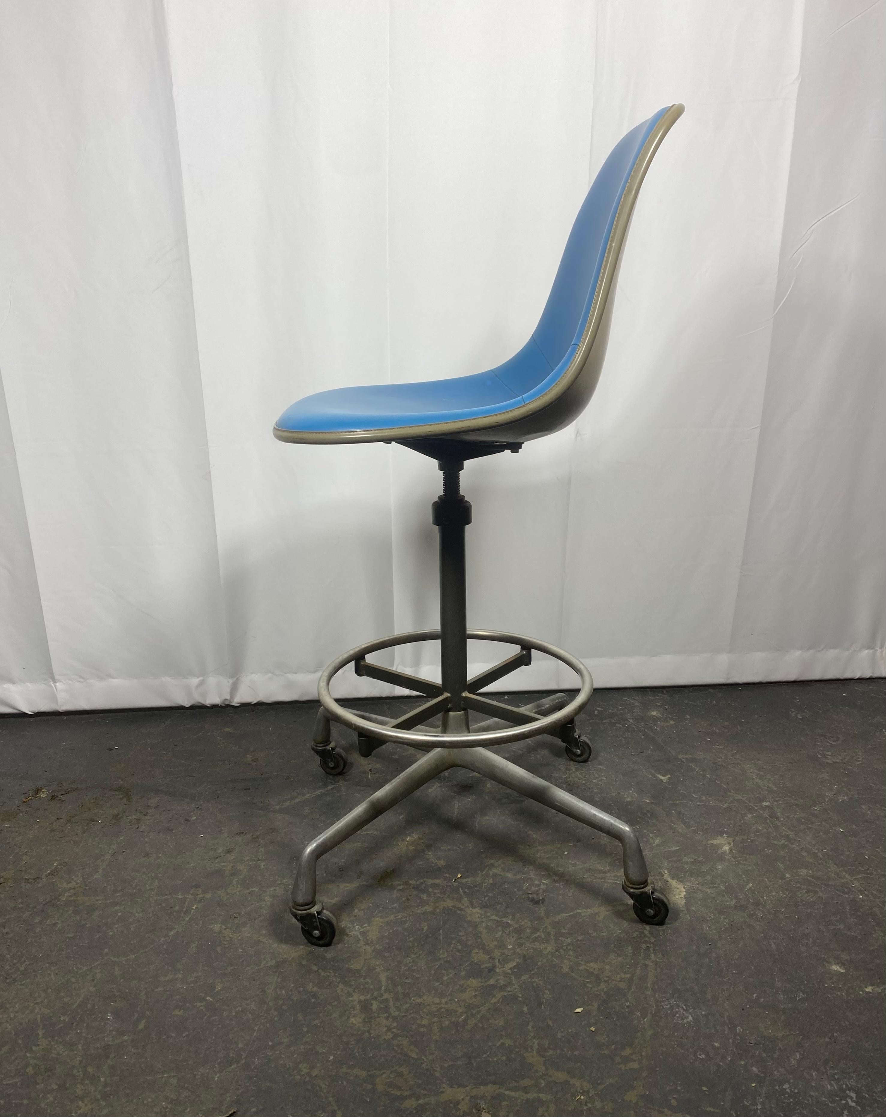 Charles and Ray Eames Drafting Stool for Herman Miller , on castors. c.1974 ,, Stunning baby blue padded shell in amazing original conditioin. Perfect for home or office,, Classic modernist design..Retains original label,, Adjustable height, 