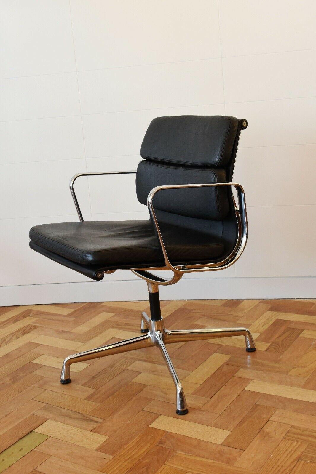 The iconic EA 208 by Charles and Ray Eames for produced by Vitra, circa 2010. 

This chair is in black leather with an aluminium 4 point base. 

The design of the Soft Pad Group dates from the year 1969. In terms of both construction and shape,