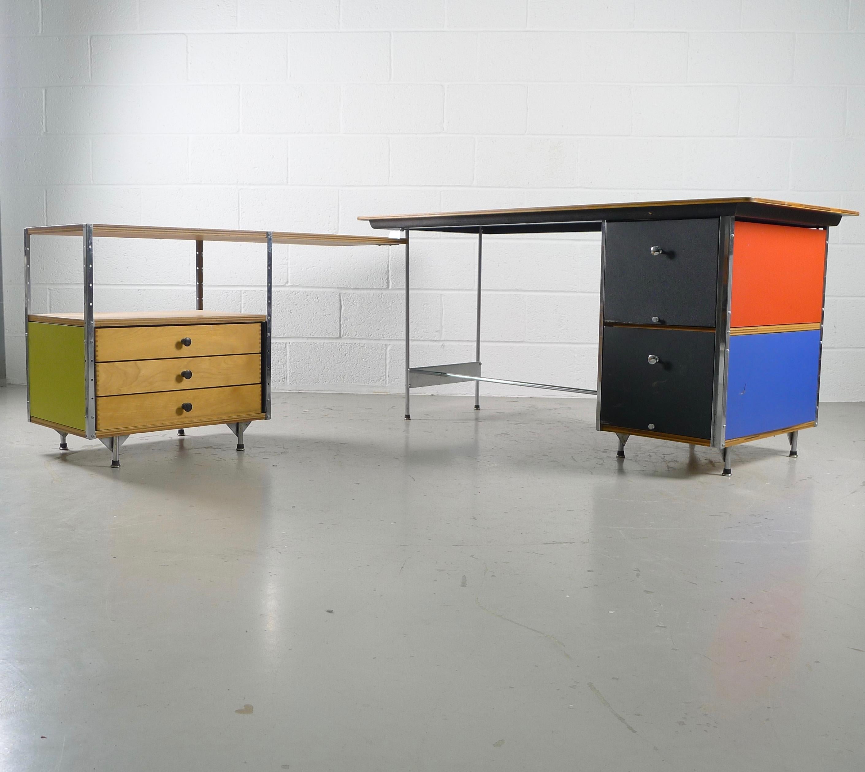 Charles and Ray Eames for Herman Miller, USA. An all original ESU desk and return. Birch ply tops, colored panels, original drawer pulls and boot glides. The shape can be changed by simply pivoting the return sections desired.

Second series