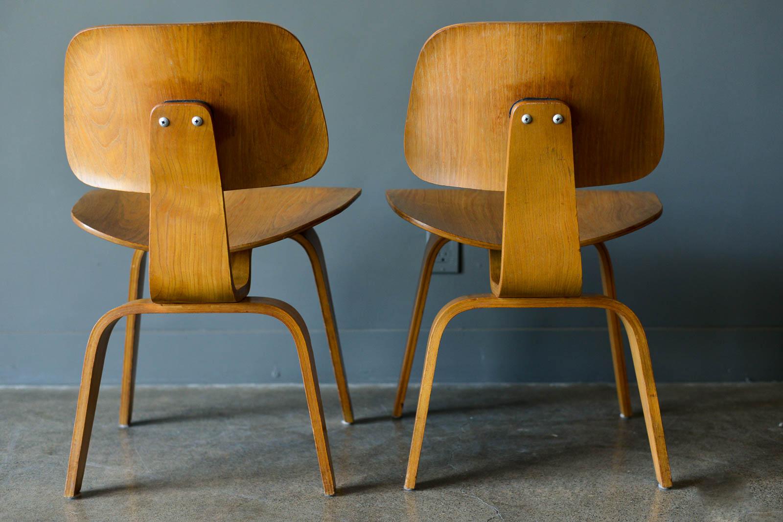 Charles and Ray Eames for Evans pair of DCW chairs, ca. 1950. Pair of original Charles and Ray Eames for Evans Products DCW (dining chair wood). Beautiful original condition with no restorations. Shock mounts are still good and usable, very slight