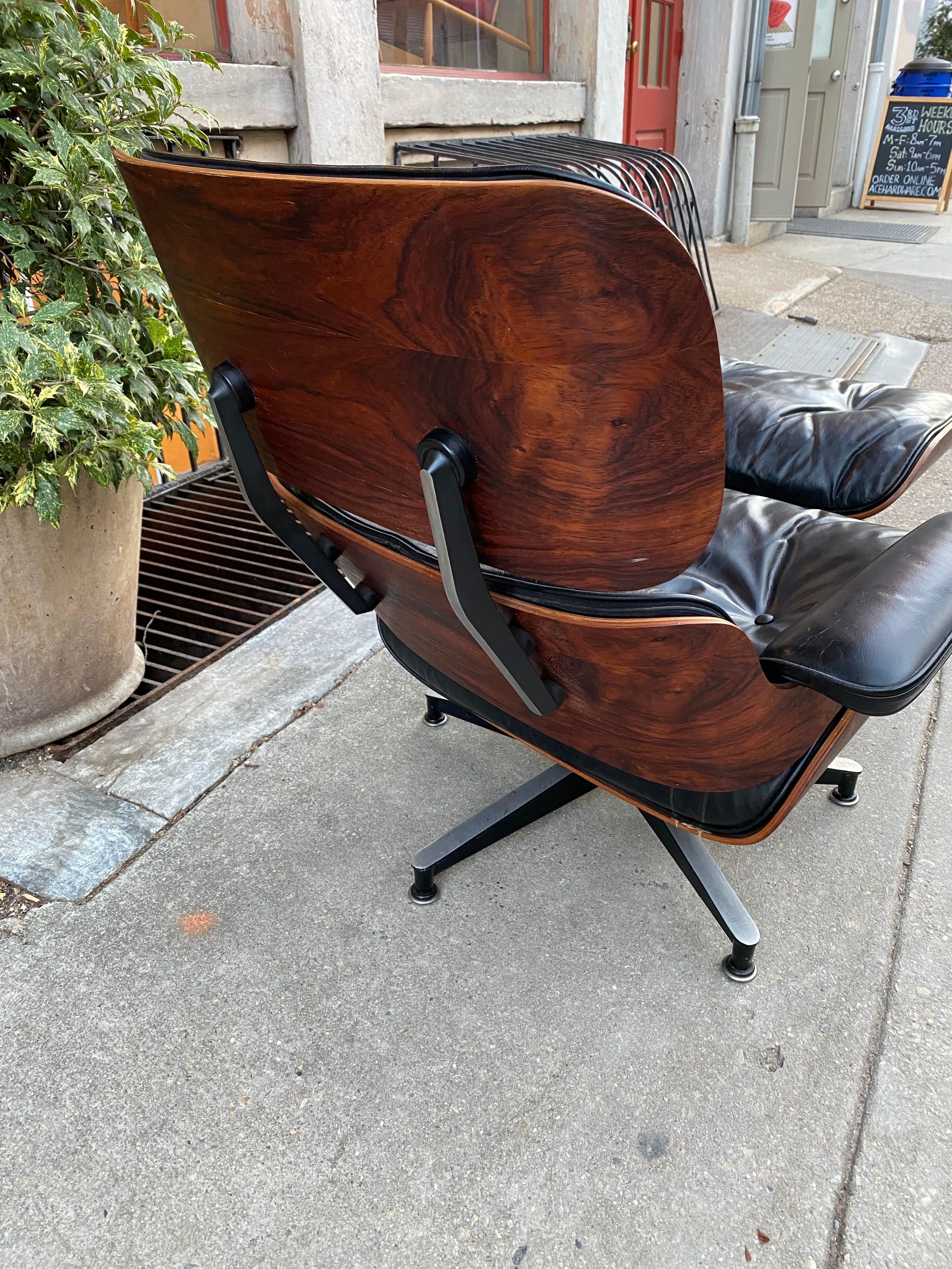 Charles and Ray Eames 670 Rosewood Lounge Chair and Ottoman.  Black leather with down filled cushions.  Wood grain on this example is really nice!  Probably one of the nicest models of this chair I have had in years!  Leather is in great condition