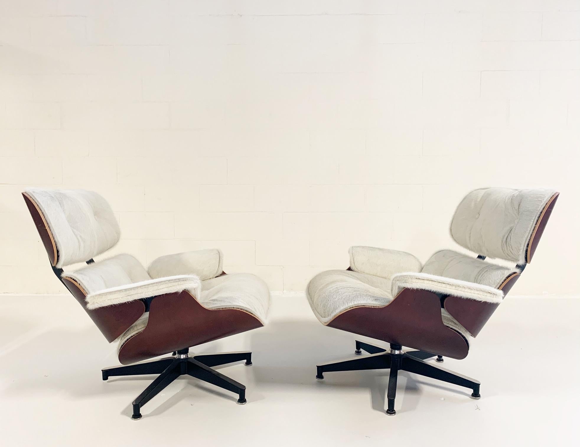 Charles and Ray Eames for Herman Miller Chairs and Ottomans Restored in Cowhide In Good Condition In SAINT LOUIS, MO