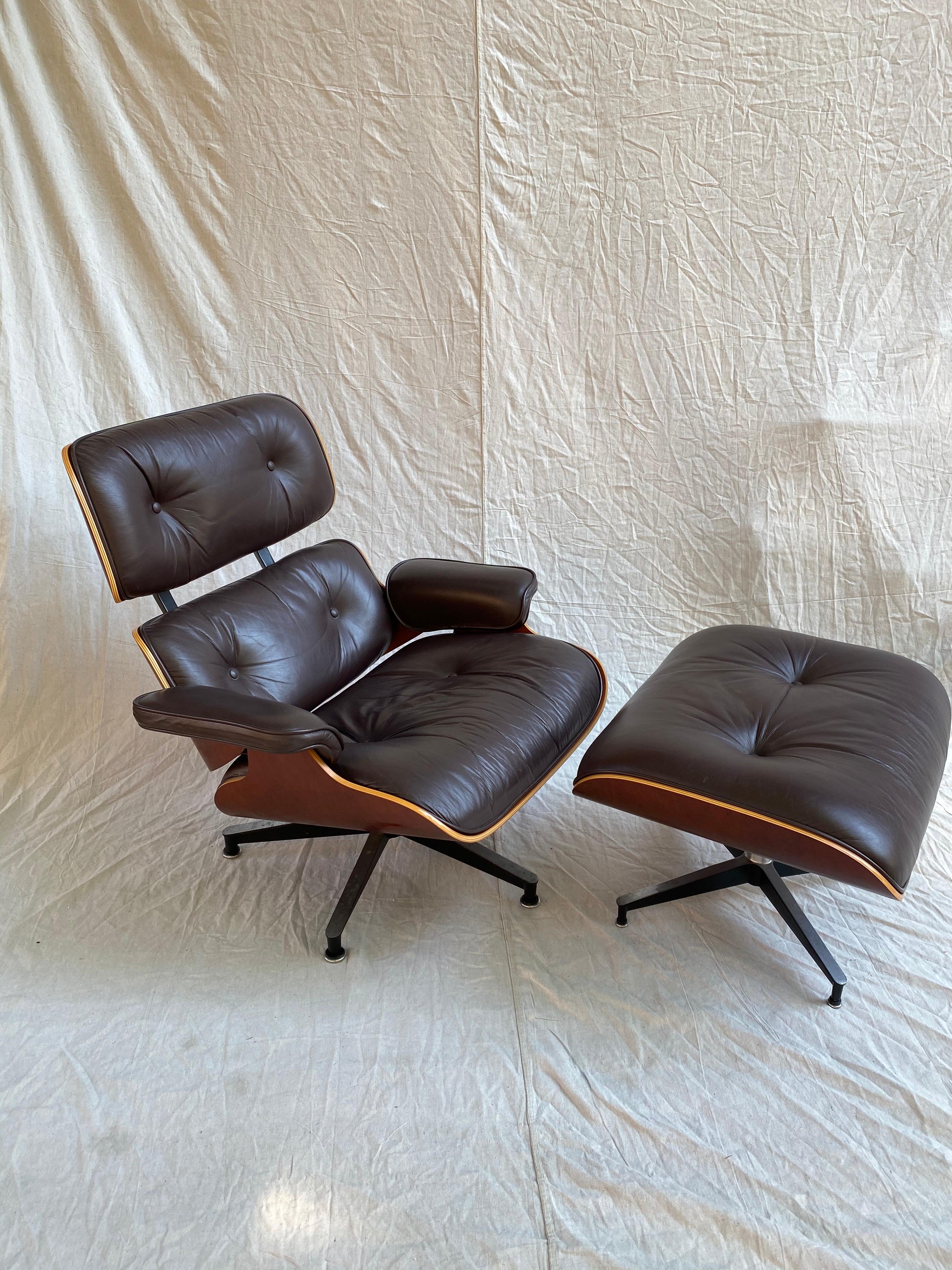 Classic Eames Design for Herman Miller! Cherry Outer shell, this chair dates to the mid-1990s. Cherry is in very good condition, showing no major wear. Leather is a deep wine or maroon. Shows minor patina to arms, but overall leather presents very