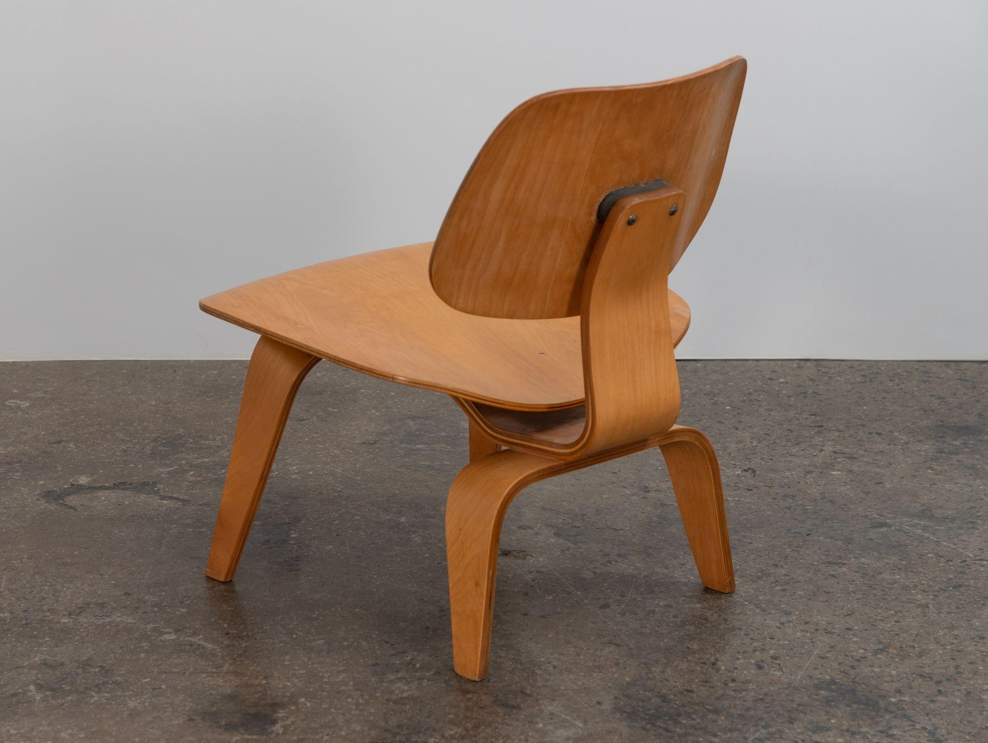 Original LCW lounge chair in birch, designed by Charles and Ray Eames for Herman Miller. Molded plywood with a low-slung profile. Legs and seat edges are very clean with no major chips. Structurally sound--shock mounts are stable and secure. Nice