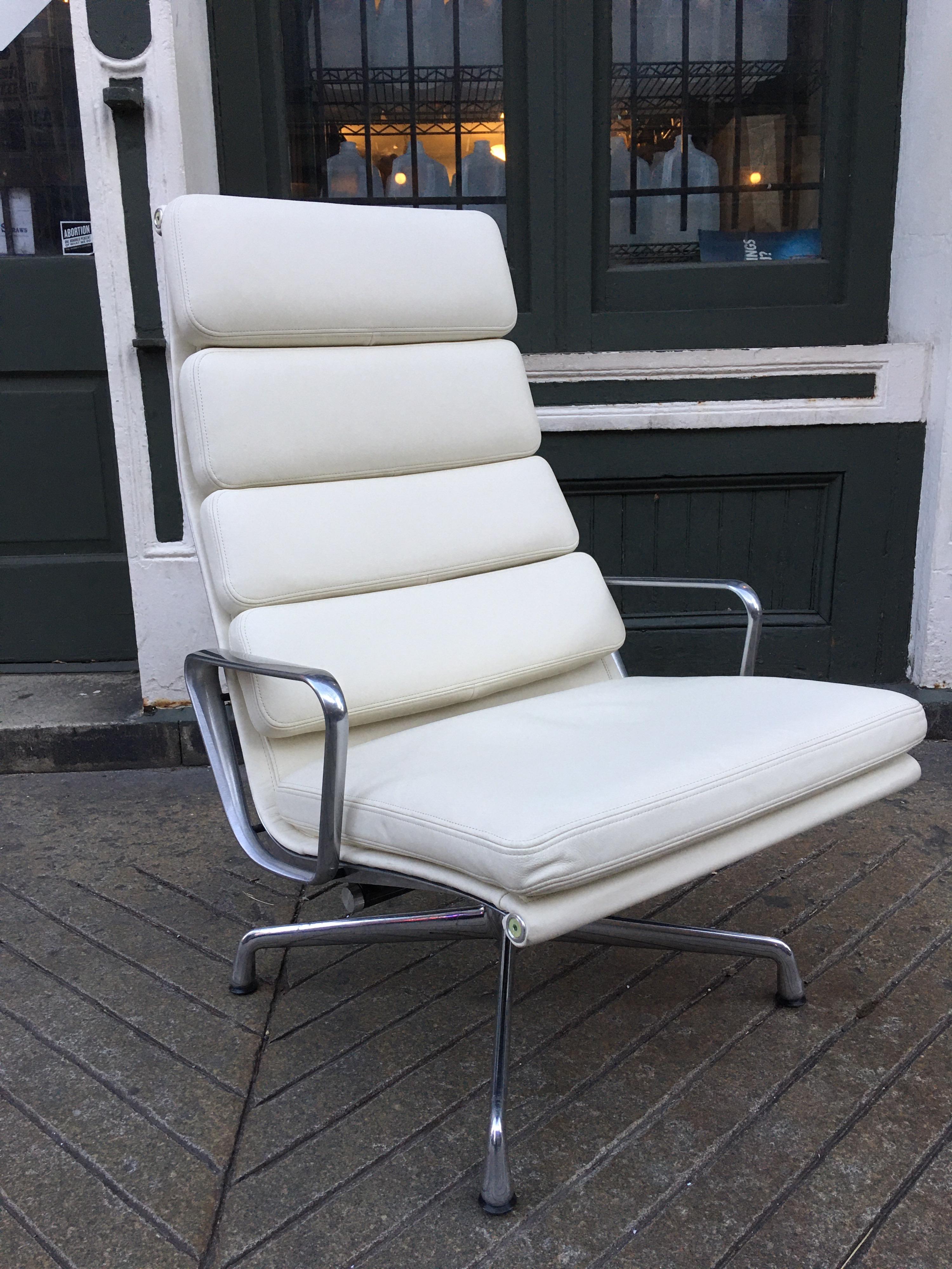Charles and Ray Eames designed soft pad lounge chair in amazing condition! Bought for a space in 2013, but never installed! Leather is flawless! Aluminum arms are very clean, base shows minimal marks on one of the legs. Overall presents as new!