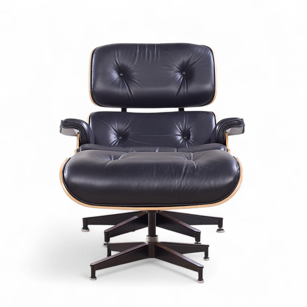 Charles and Ray Eames for Herman Miller Mid Century Walnut Eames Lounge Chair with Ottoman

The chair measures: 33 wide x 37 deep x 34 high, with a seat height of 17.5 inches and arm height/chair clearance of 21 inches
The ottoman measures: 26 wide