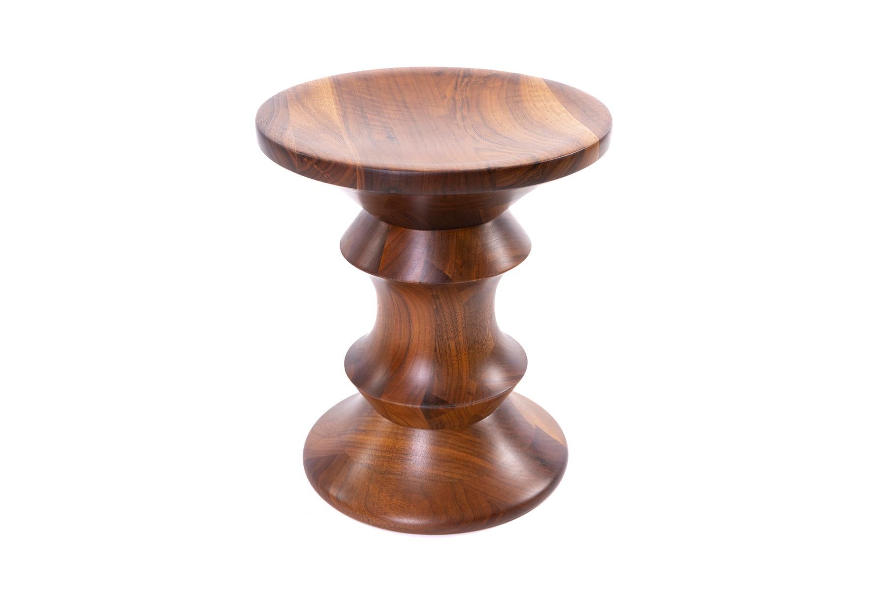 Charles and Ray Eames for Herman Miller time life stool, circa mid-1960s. This solid walnut example has incredible graining and has been newly detailed with 5 coats of tongue oil. In between each coat the stool was polished so the color is and
