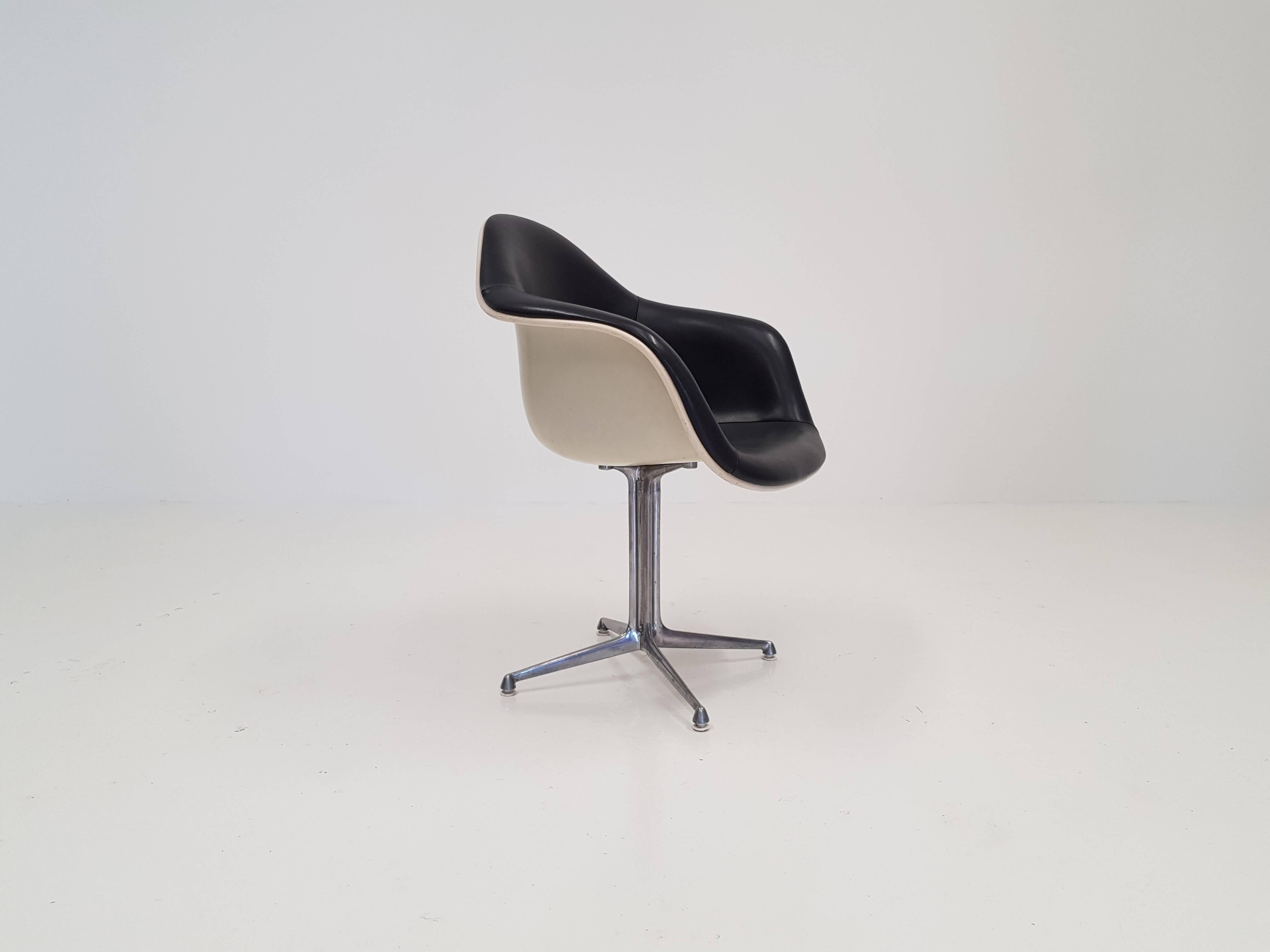 Eames 'La Fonda' chair. Aluminium frame with fibreglass shells and grey leatherette, Herman Miller.

We can offer very competitive global shipping rates - please 'ask the seller' to discuss further.