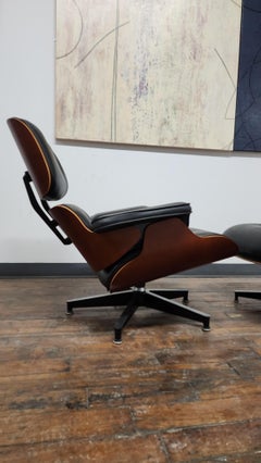 Charles and Ray Eames Sessel und Ottomane für Herman Miller in Cherry