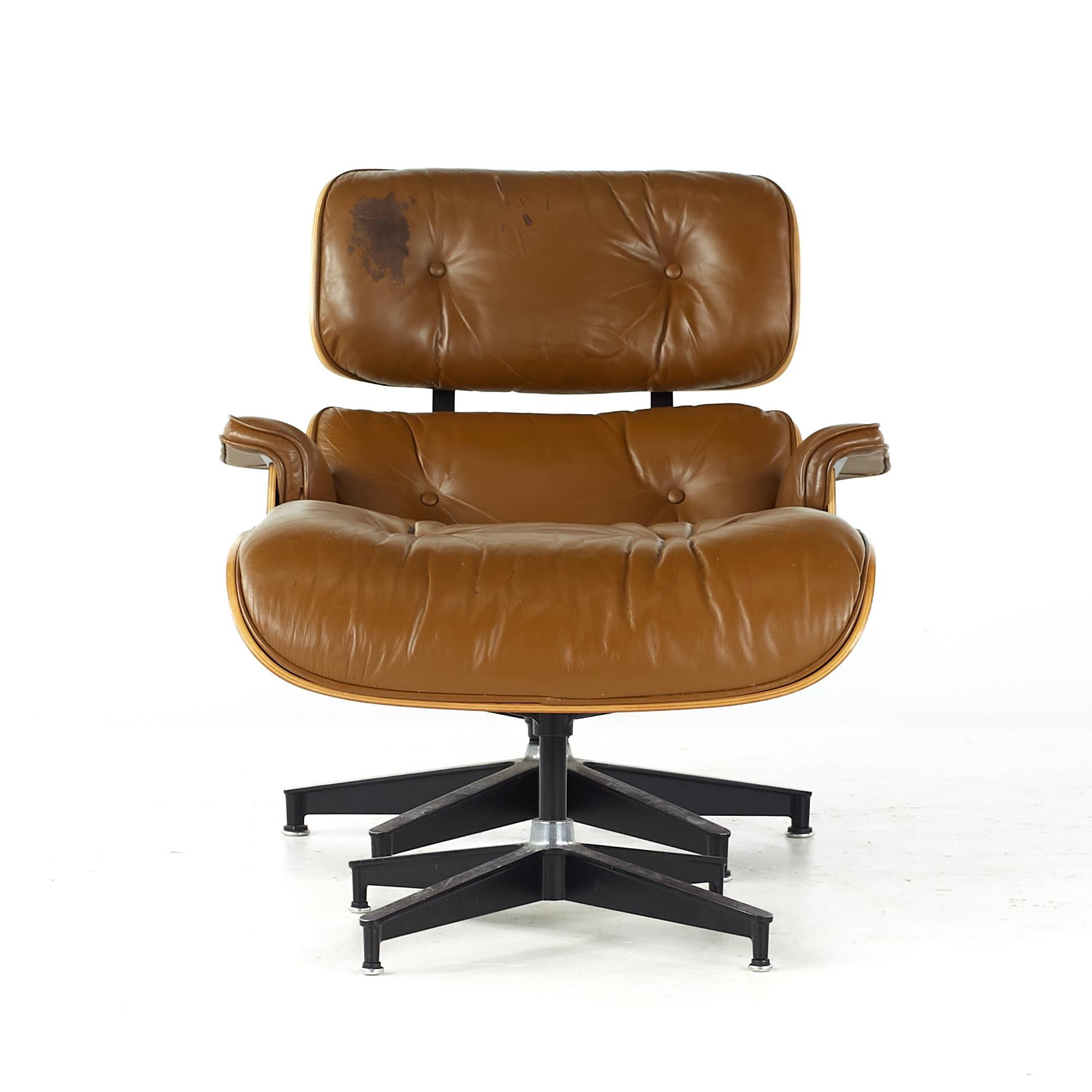 Charles and Ray Eames midcentury Cherry lounge chair and ottoman

The chair measures: 32 wide x 34 deep x 32 high, with a seat height of 15 inches and arm height/chair clearance of 20 inches
The ottoman measures: 25.5 wide x 22 deep x 17.5 inches