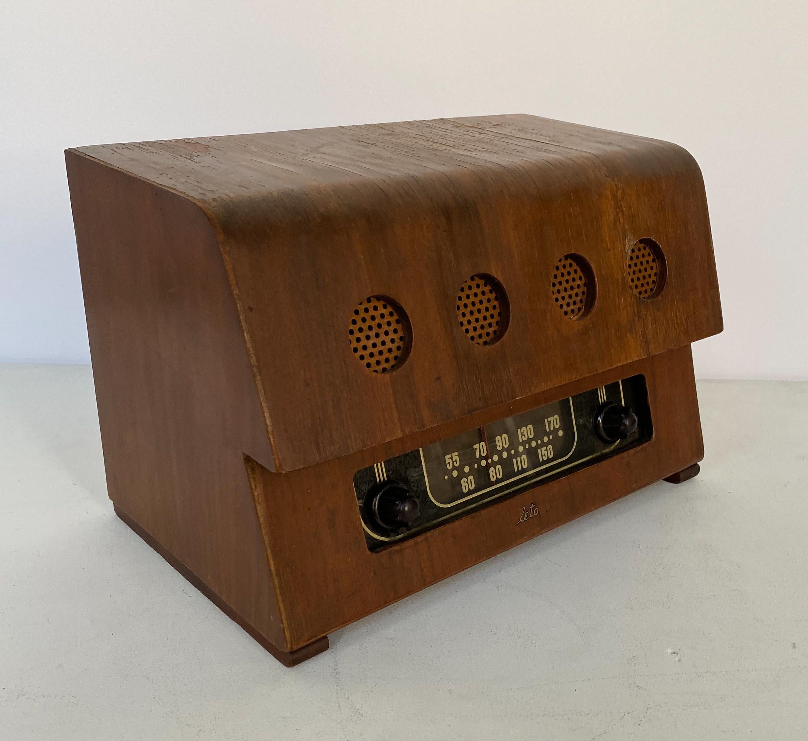 Radio of molded and cut walnut plywood, bakelite, glass and perforated masonite. Designed by Charles and Ray Eames and produced by Evans Products for Teletone, circa 1946. As Richard Wright noted in 2004, 