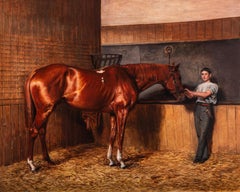 'Avontes' a bay stallion with a groom in a stable interior
