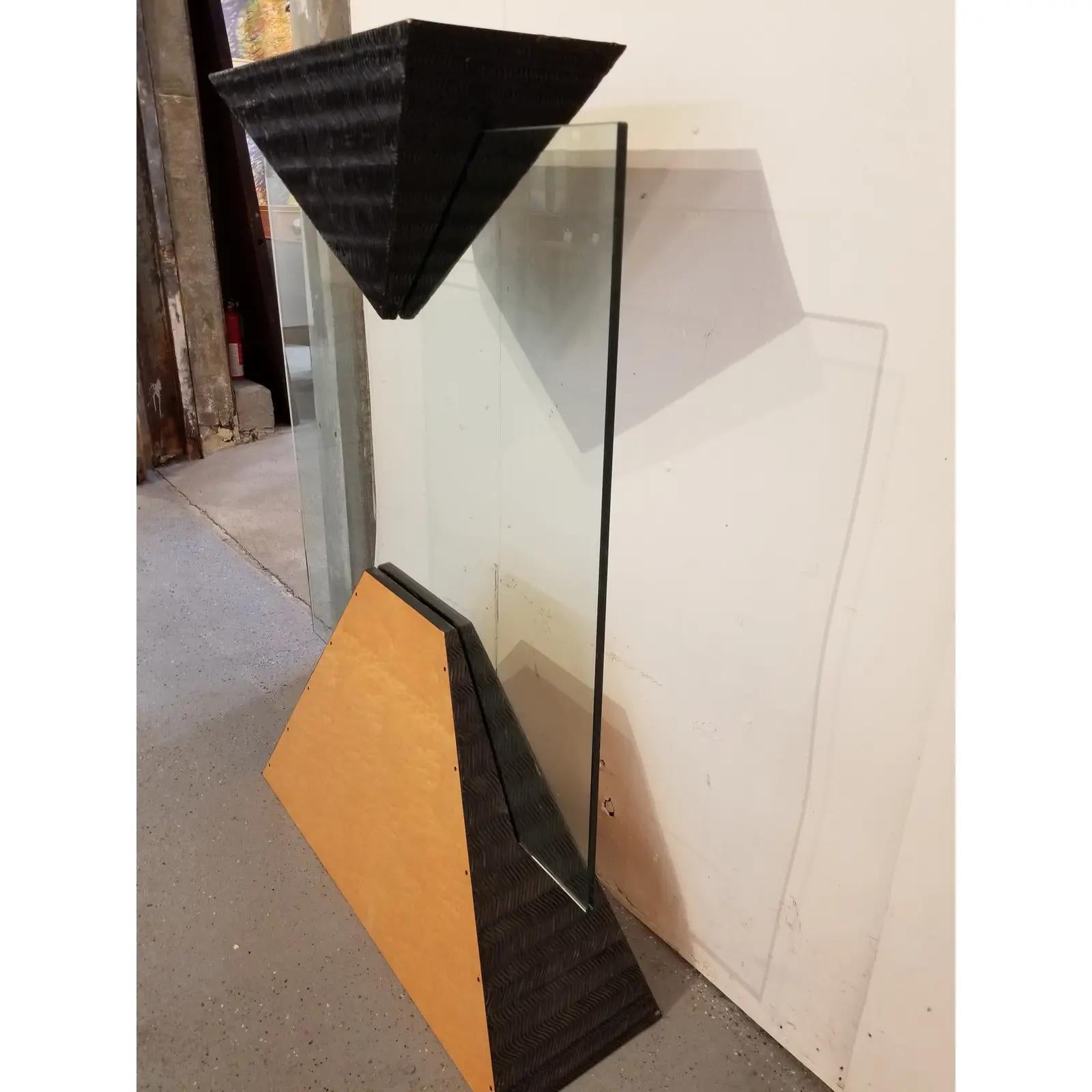 Charles B. Cobb California Studio geometric floor sculpture . Glass rectangular panel supported by two geometric, pyramid forms. Various imperfections.

50.5 inches high.
36 inches wide.
11.5 inches deep.
Top surface measures 10