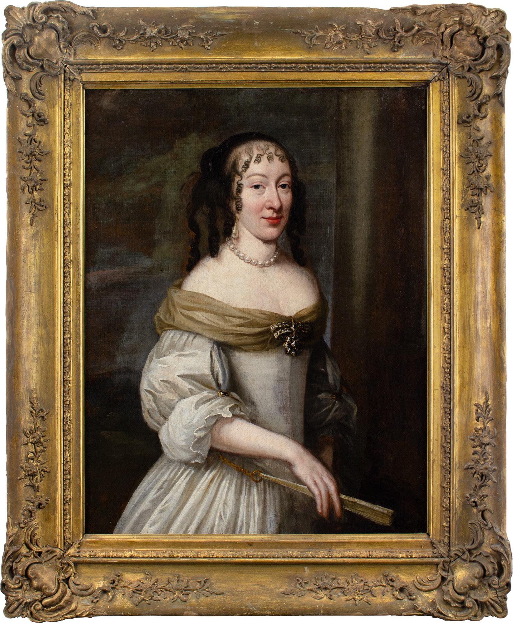 This splendid mid-17th-century, three-quarter length, portrait depicts a lady of the French court attired in an off-the-shoulder ivory gown together with a scarf, jewellery and fan. It was produced circa 1660 by an artist working in the circle of