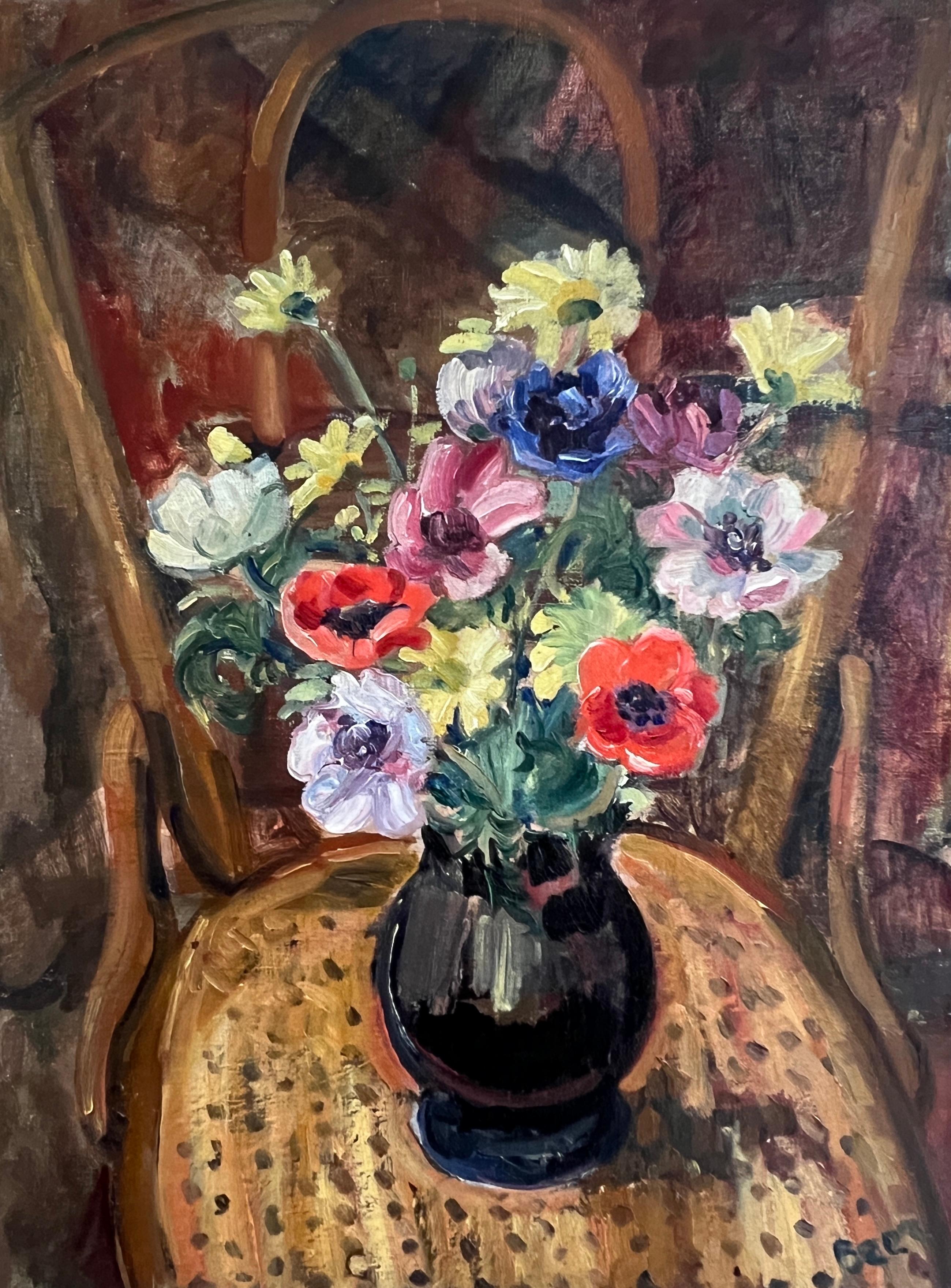 Bouquet of flowers in vase on an armchair