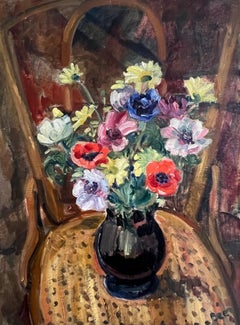 Vintage Bouquet of flowers in vase on an armchair