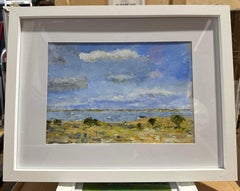 Impressionist scene of boats sailing in an inlet with a landscape