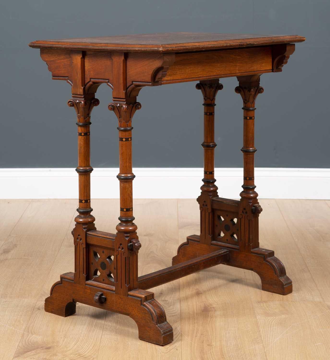 Charles Bevan. For Marsh and Jones of Leeds. A rare Gothic Revival Walnut with Burr Walnut top side table, with molded edge to the burr walnut top, a single drawer and raised on corinthian column legs with ring turnings and dot and circular inlays,