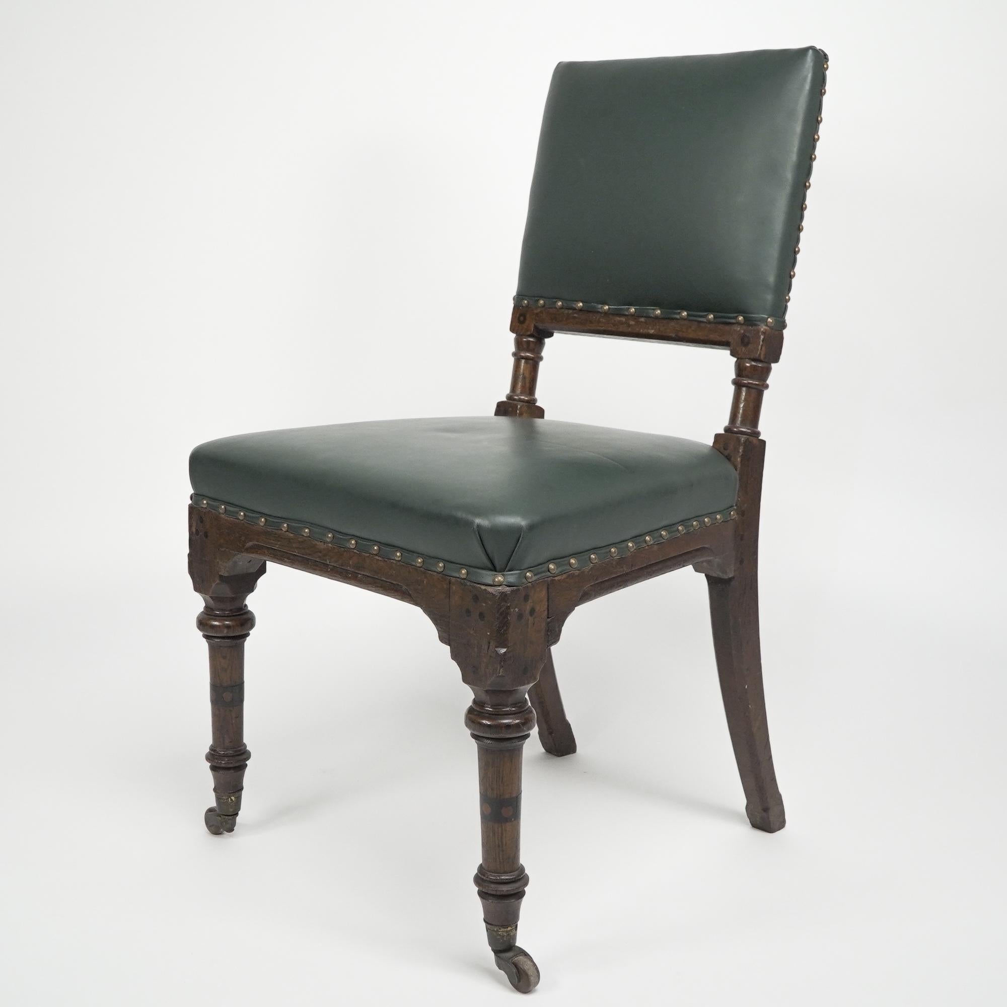Charles Bevan attributed. A gothic Revival side chair with chamfered edges, and ebonized dot decoration to the lower back, and to the front and back seat corners. With ring turned supports below the upholstered back and a nice scroll details around