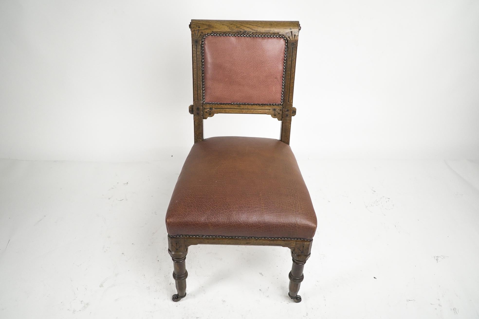 English Charles Bevan attributed. A Gothic Revival side chair with scroll carvings For Sale