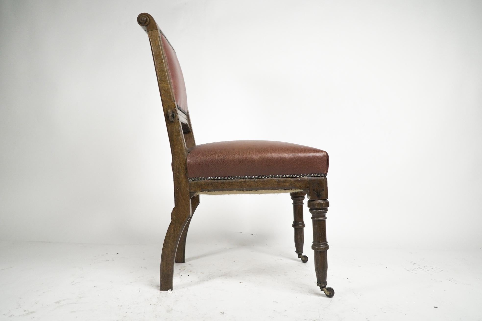 Ebonized Charles Bevan attributed. A Gothic Revival side chair with scroll carvings For Sale