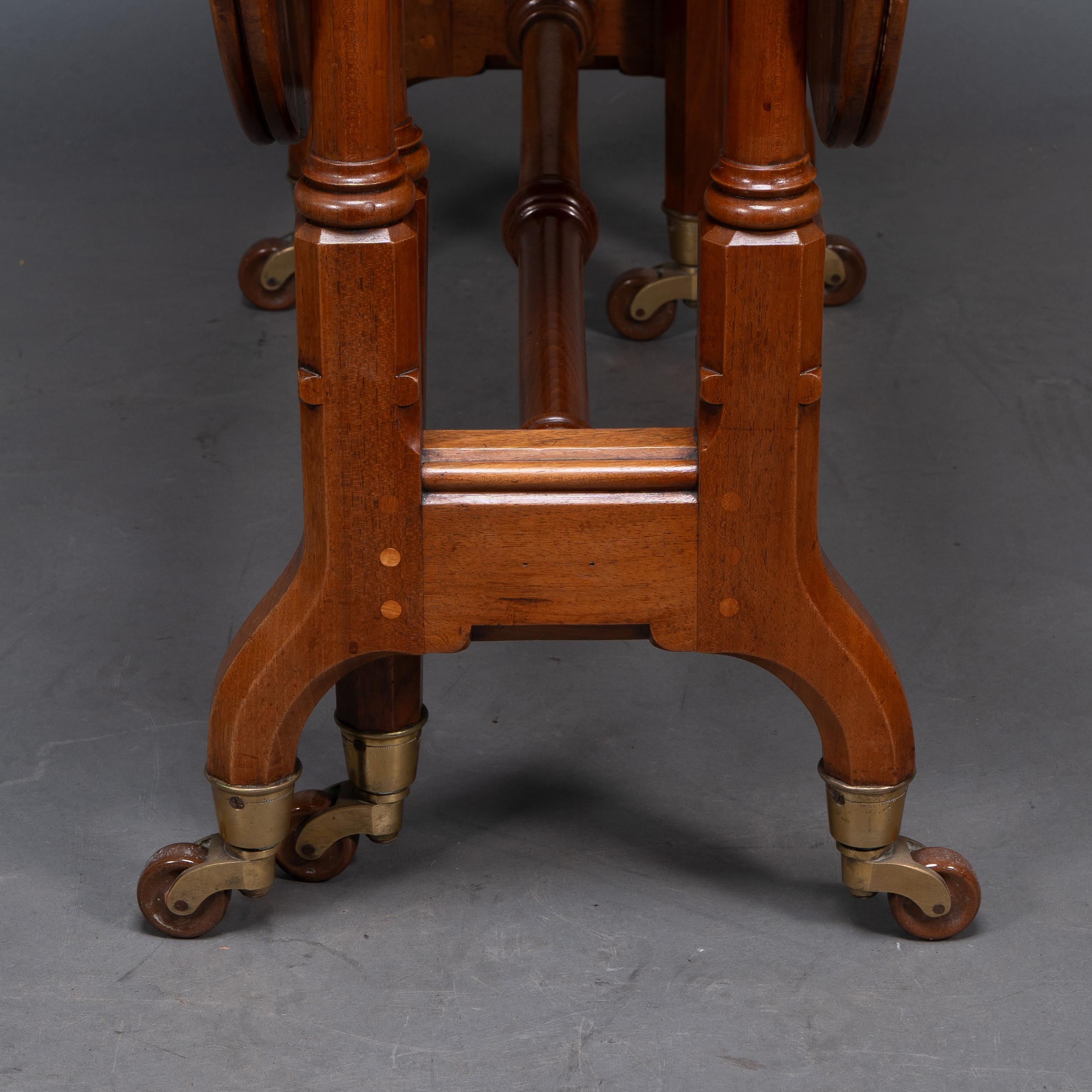 Charles Bevan for Marsh & Jones. A Gothic Revival burr walnut Sutherland table For Sale 1