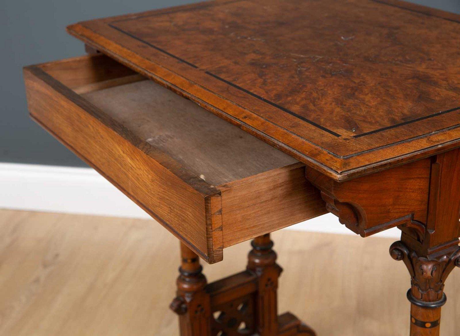 English Charles Bevan for Marsh & Jones. A Small Walnut Writing Table on Turned Supports For Sale
