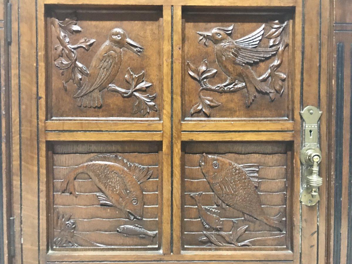 Late 19th Century Charles Bevan, Gillows & Co. An Aesthetic Oak Cabinet with Carved Birds & Fish For Sale