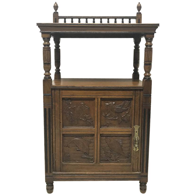Charles Bevan, Gillows & Co. An Aesthetic Oak Cabinet with Carved Birds & Fish For Sale