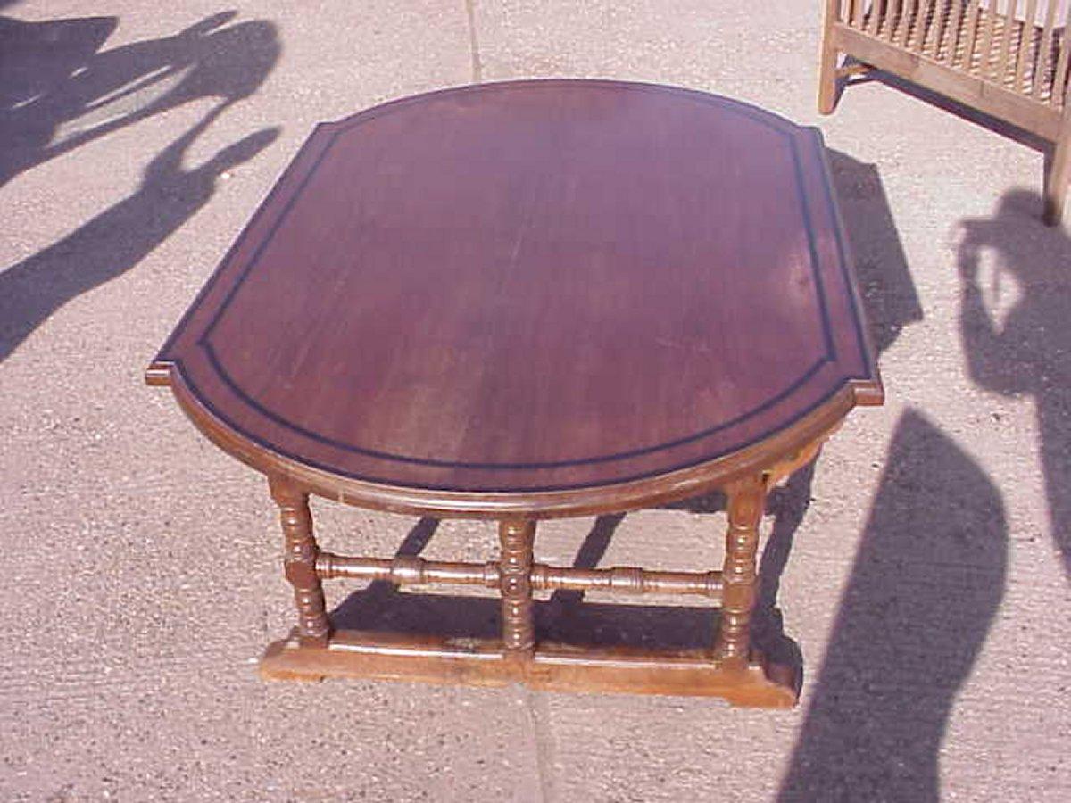 Charles Bevan attributed, made by Marsh, Jones and Cribb. 
An Aesthetic Movement walnut centre table with ebony line inlaid details. 
The rectangular top with D ends, turned legs with cross style stretchers, united by a central 
 stretcher with