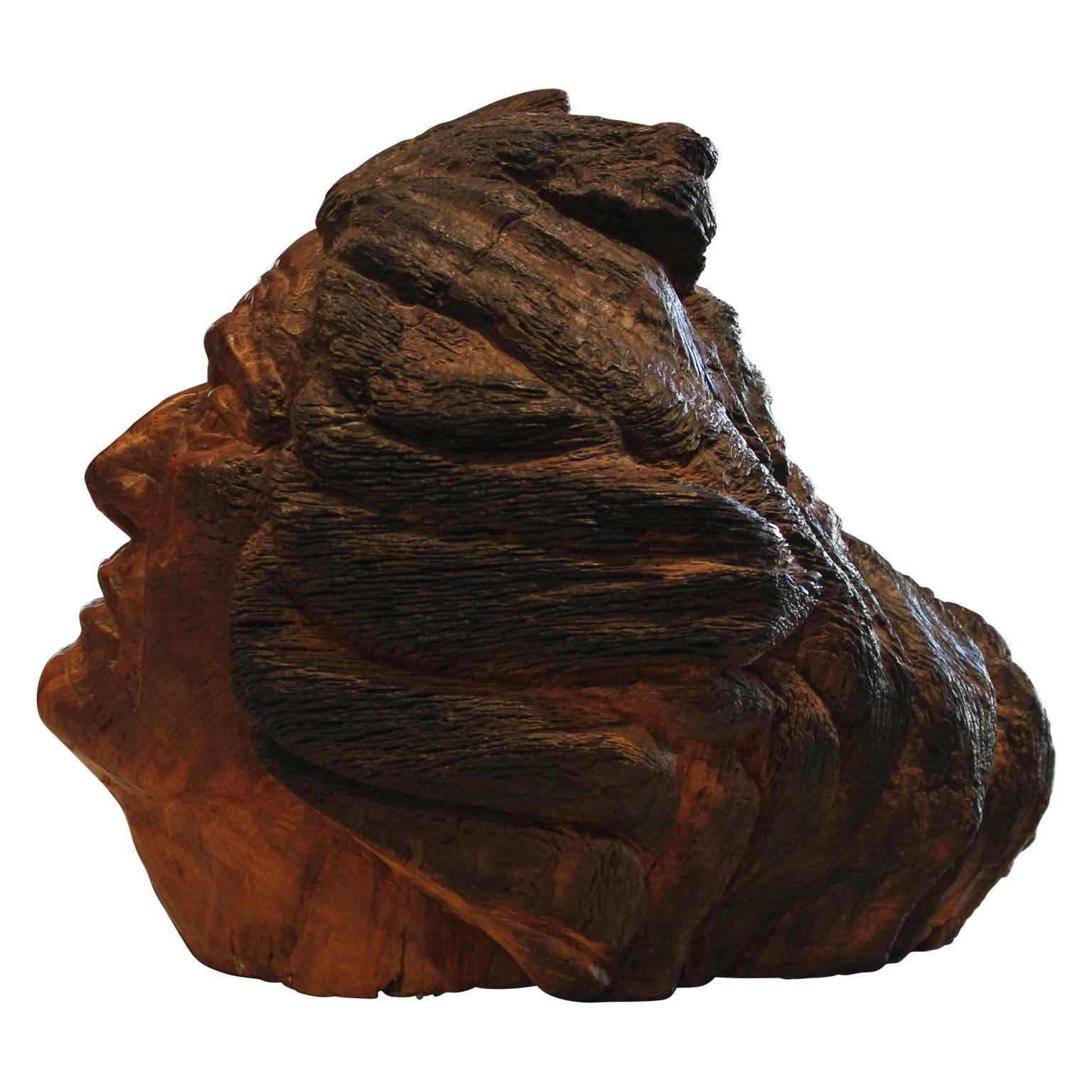 Carved walnut sculpture of an older man looking majestically off into the distance as his hair streams behind him by Texas artist Charlie Boren in the 1980's. 

Artist biography: 
Mr. Boren was born in 1927 in Snyder, Texas, to a pioneering family