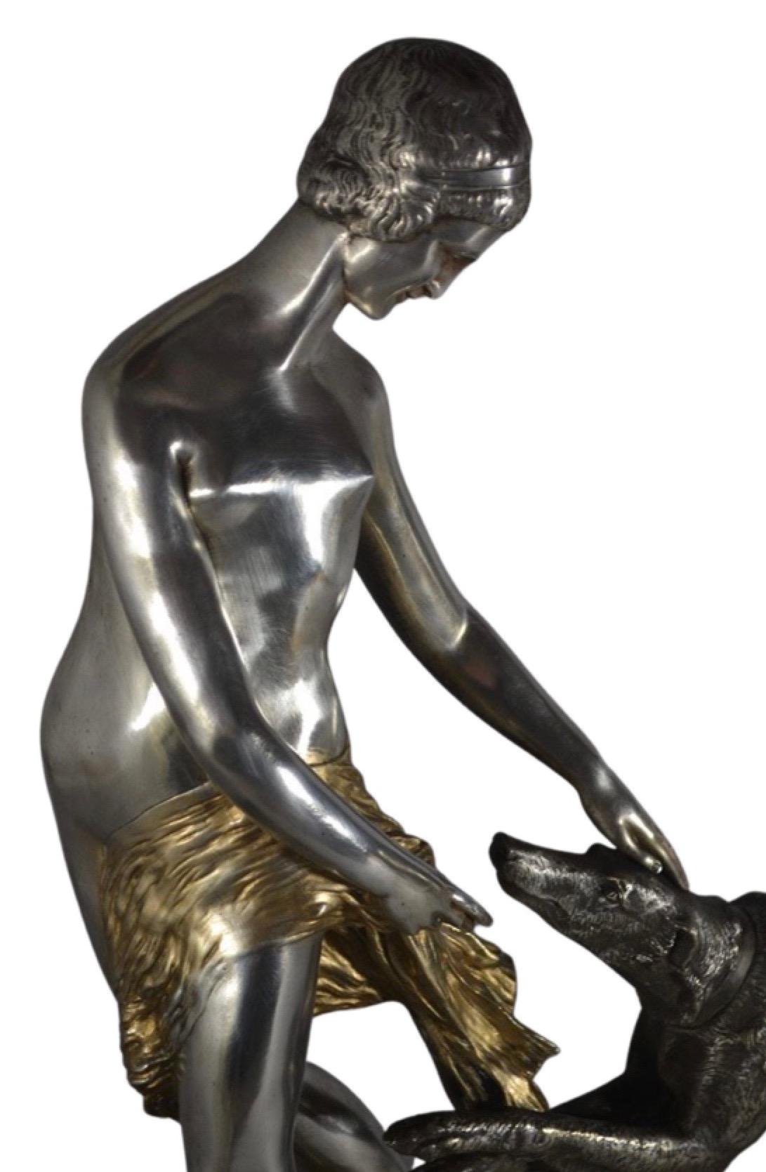 Large Bronze by Charles Breton silver-plated and gilded bronze on marble. Signed on the bronze circa 1920. The stunning piece, which stands 25? tall and 25? wide demands one’s attention. There is a lyrical aspect to the woman’s form, as her body and