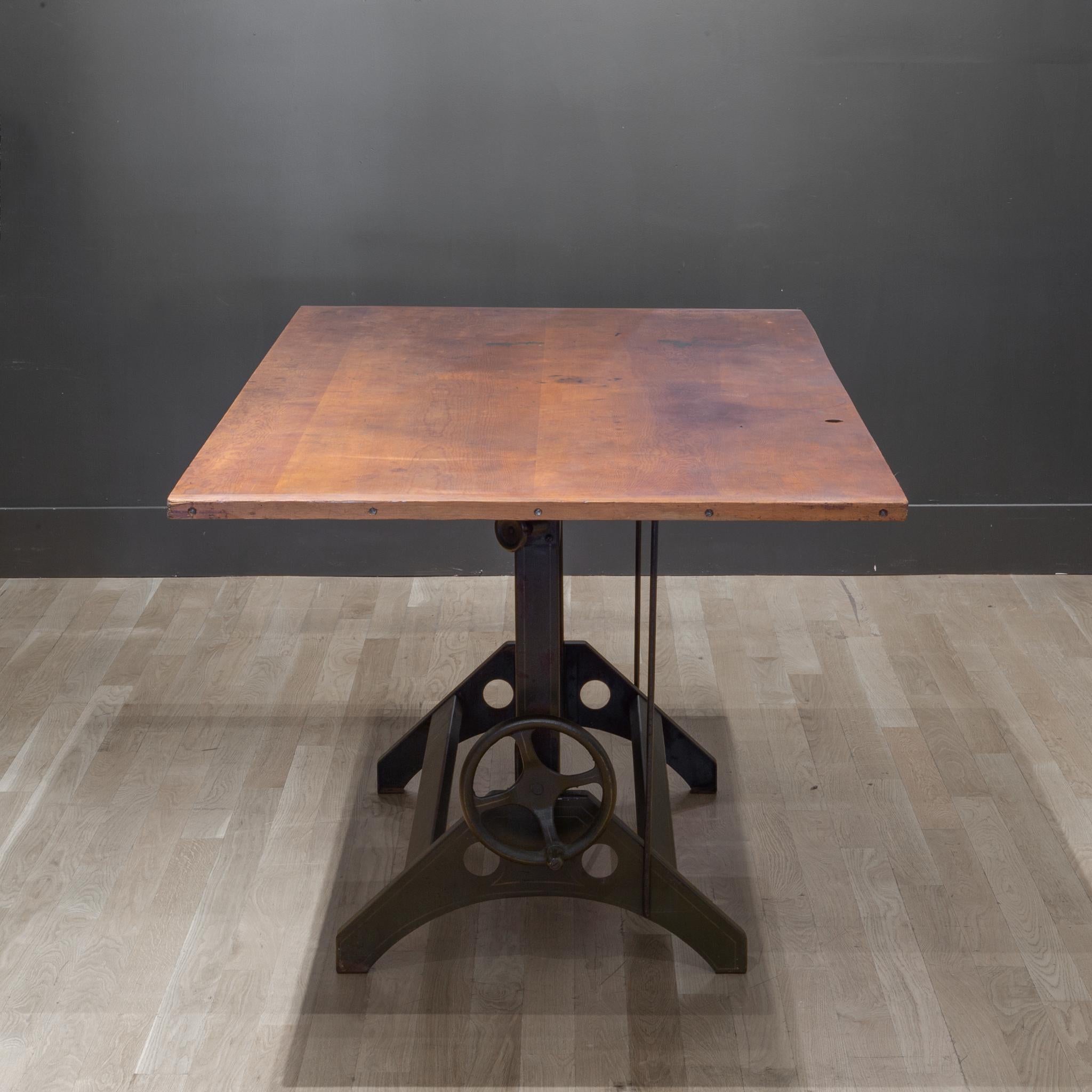 About

An industrial steel drafting table with large, wooden top and large handle on the side. The steel base is an Army green with gold stripes. The table can be used as a dining table, desk or drafting table. If used as a drafting table, the