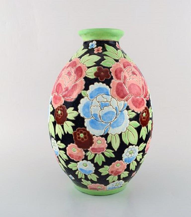 Charles Catteau (1880-1966) for Boch Freres Keramis, Belgium. Large Art Deco ceramic vase in cloisonné technique. Hand painted with flowers, 1920s-1930s.
Measures: 30.5 x 20 cm.
In very good condition.
Stamped.


    