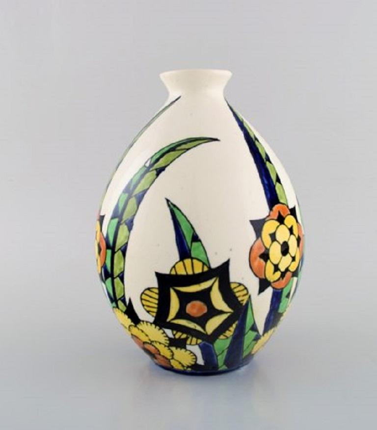 Charles Catteau (1880-1966) for Boch Freres Keramis, Belgium.
Art Deco ceramic vase in cloisonné technique. Hand-painted with flowers, 1920s-1930s.
Measures: 23 x 16.5 cm.
In very good condition.
Stamped.