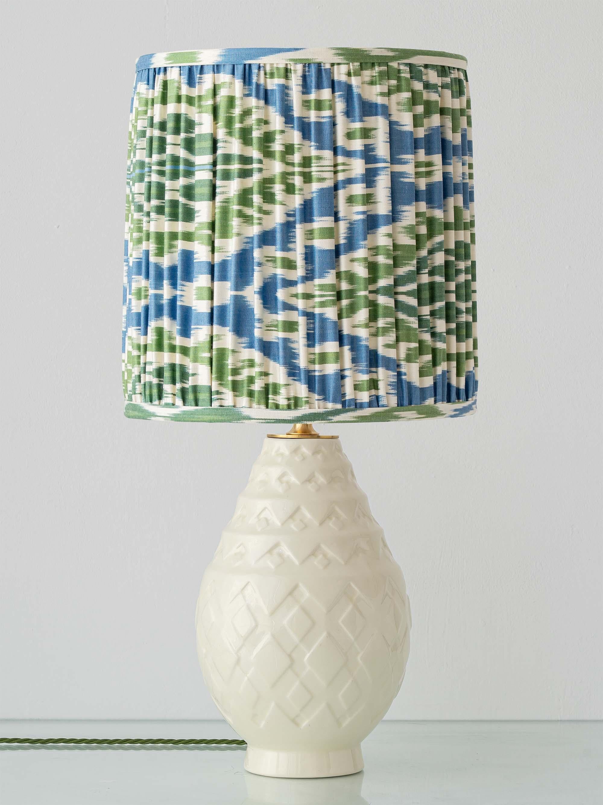 Lovingly handcrafted by Amitābha Studio in Amsterdam from an antique Boch Frères Keramis vase (Model 1118, circa 1920–1930) designed by Charles Catteau, this one-of-a-kind table lamp transforms the iconic Art Deco “pineapple” vase. We’ve paired the