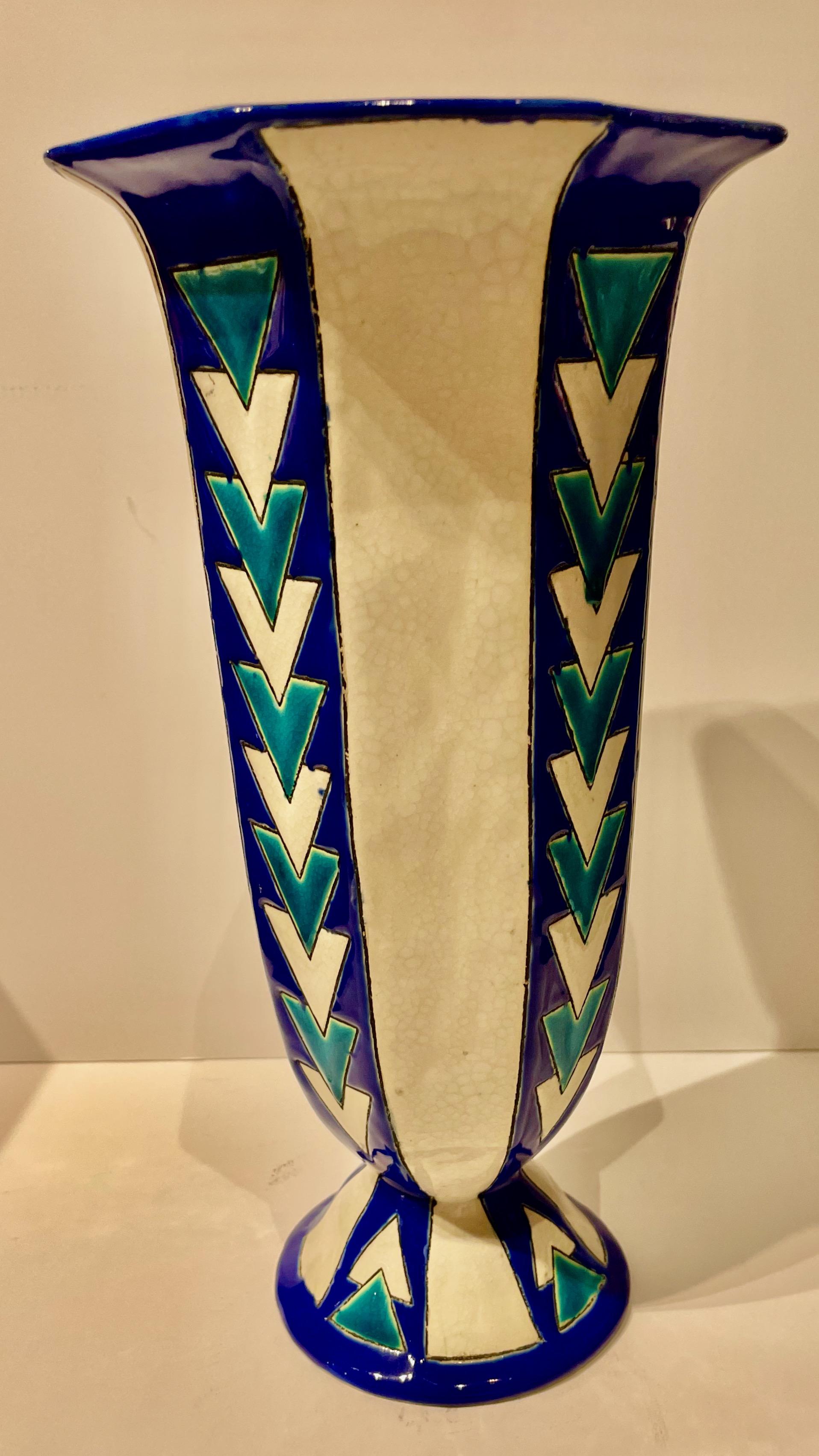 A highly stylized Art Deco vase by the master ceramicist, Charles Catteau of Boch Pottery. The bold use of bright colors in the technique known as ceramic cloisonné makes a strong statement in this very collectible piece. Strong geometric design